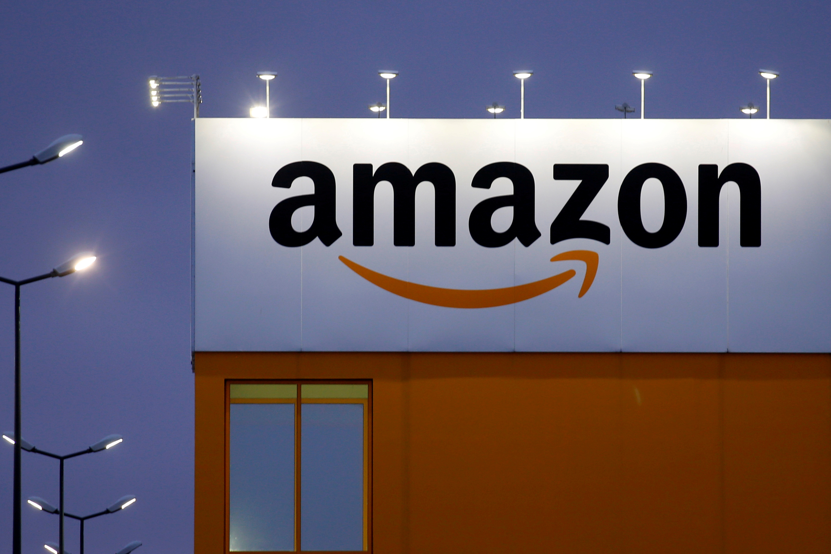 The logo of Amazon is seen at the company logistics center in Lauwin-Planque, northern France