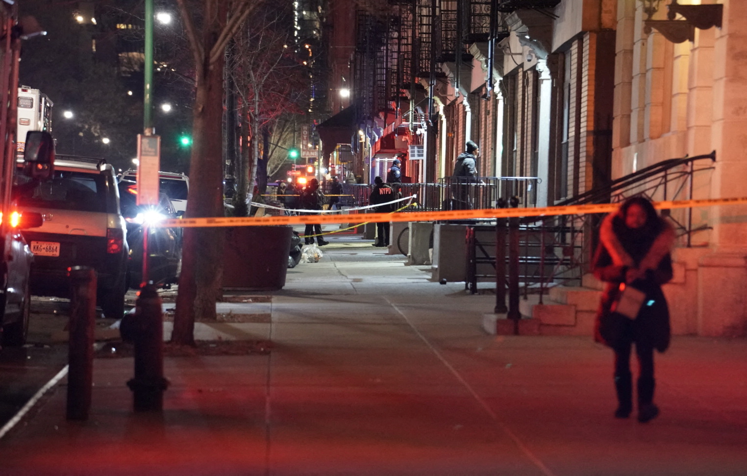 Emergency personnel respond at the scene where NYPD officers were shot while responding to a domestic violence call