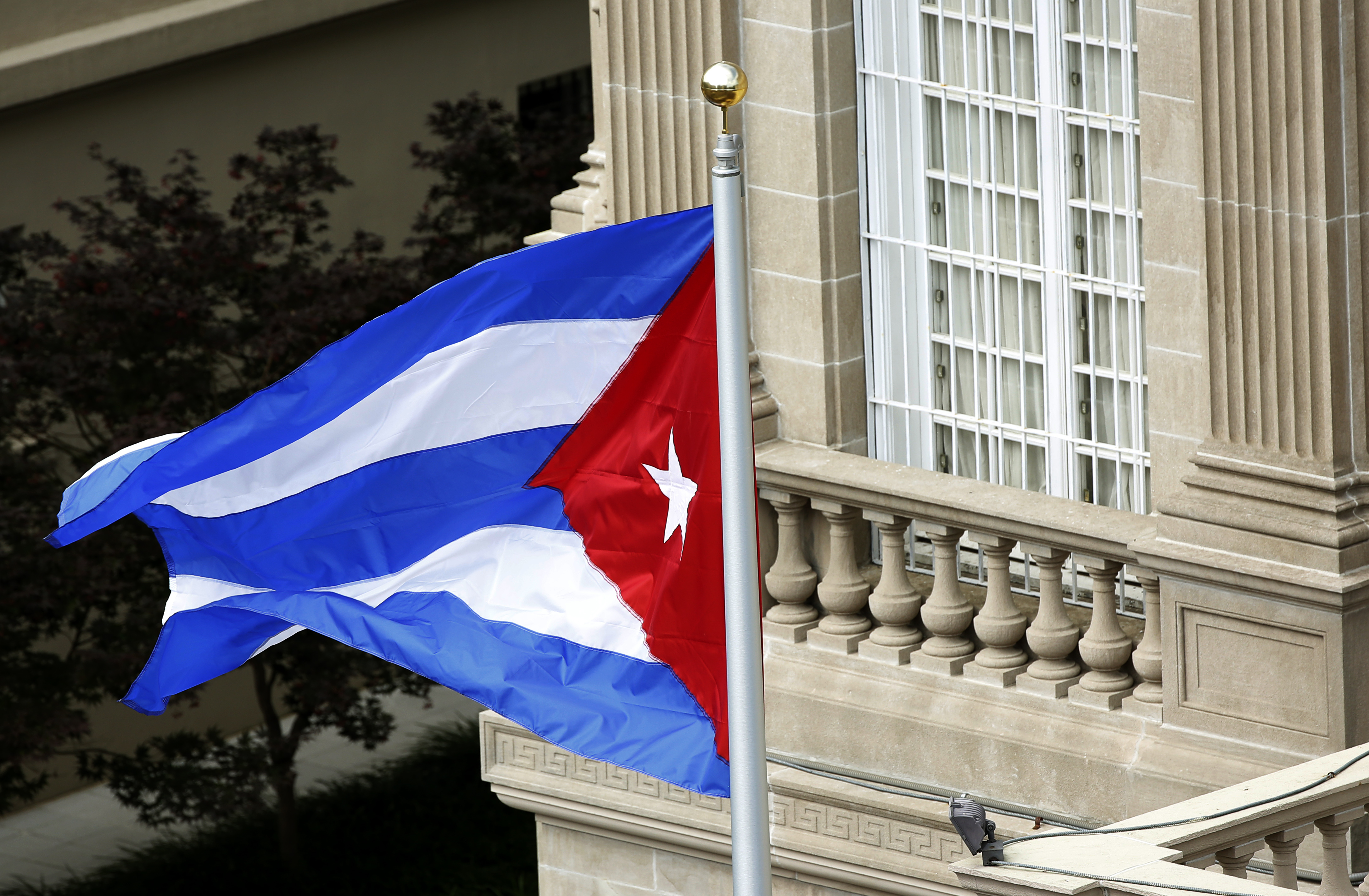Cuban flag flutters in wind after being raised at embassy in Washington