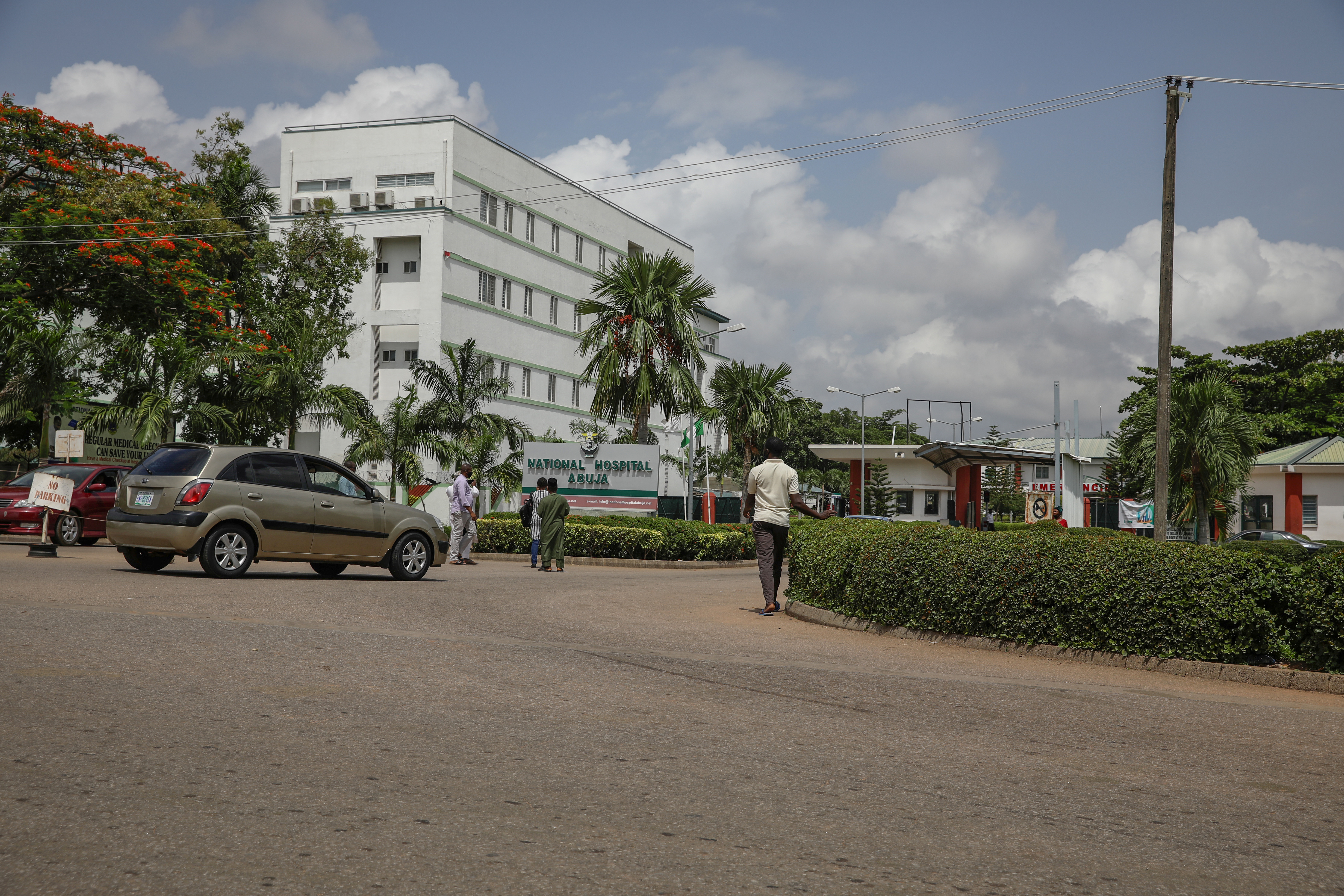 People are seen going into the National hospital after resident doctors commence a doctors strike, as coronavirus disease (COVID-19) infection continues to rise in Abuja