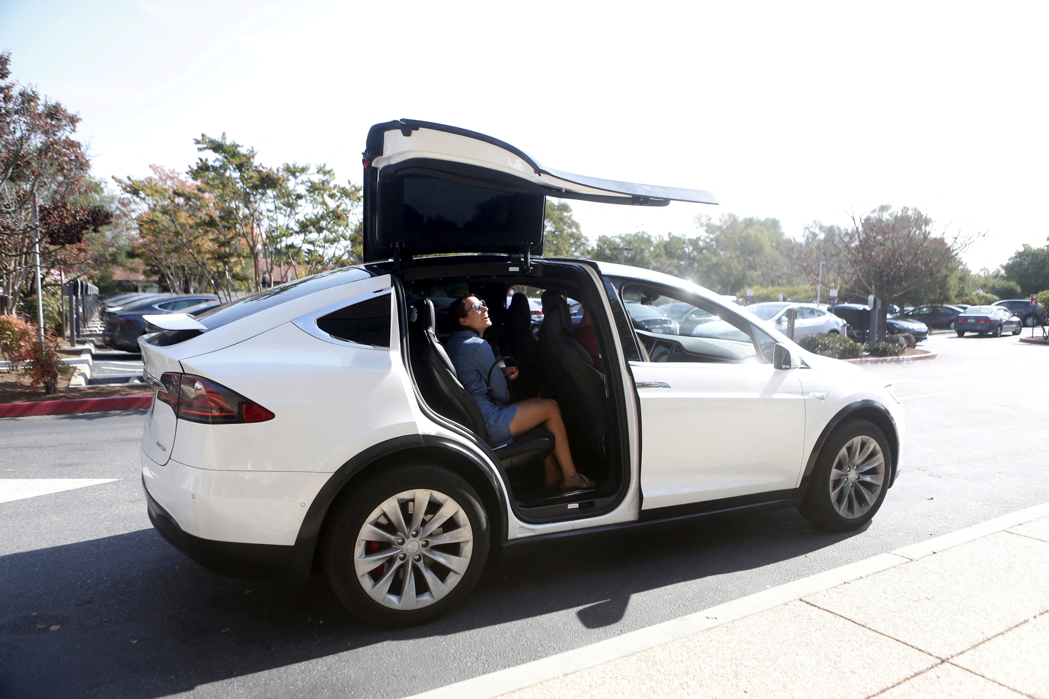 A Tesla Model X picks up passengers during a Tesla event in Palo Alto, California