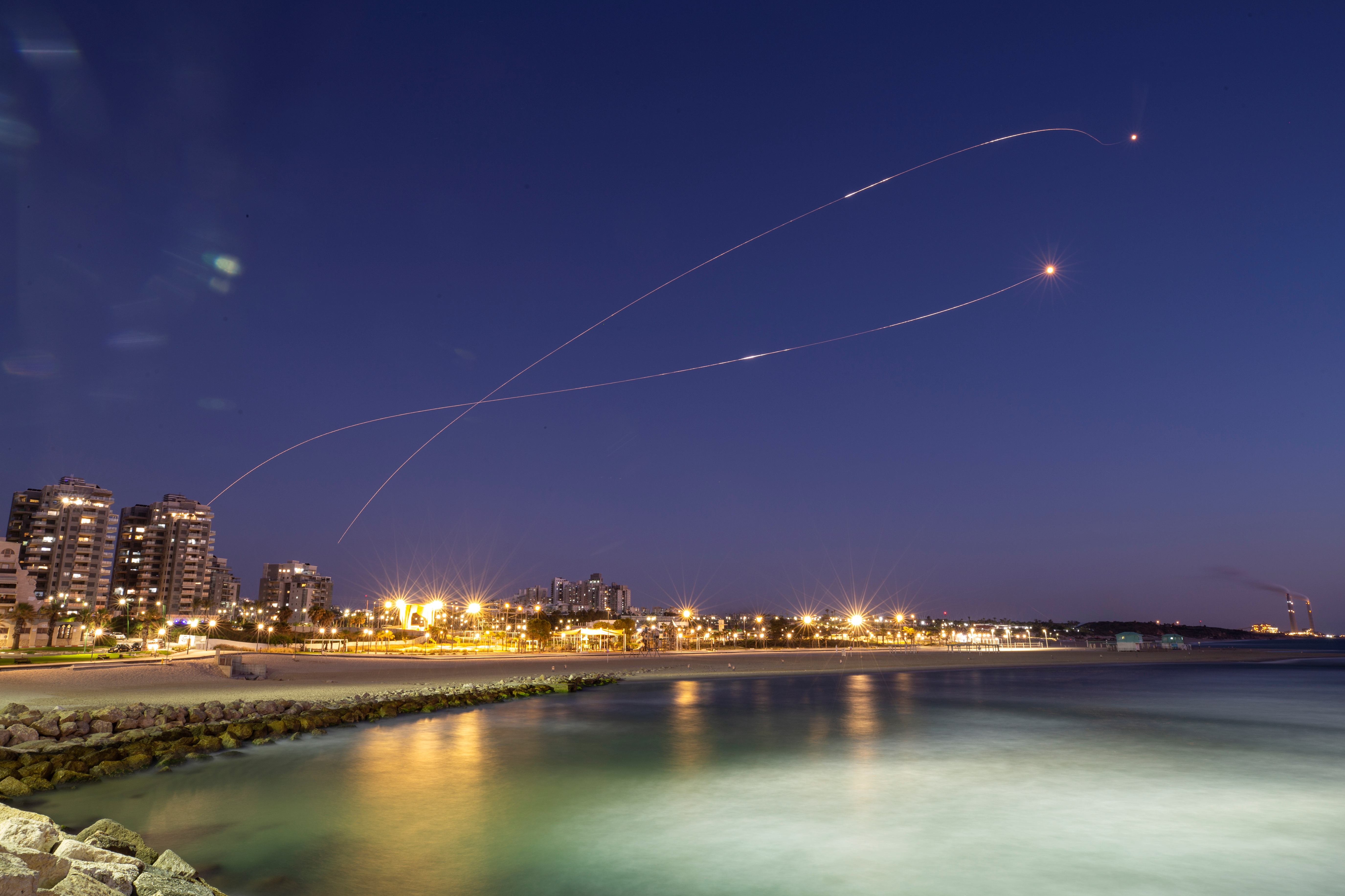 Streaks of light are seen as Israel's Iron Dome anti-missile system intercept rockets launched from the Gaza Strip towards Israel, as seen from Ashkelon