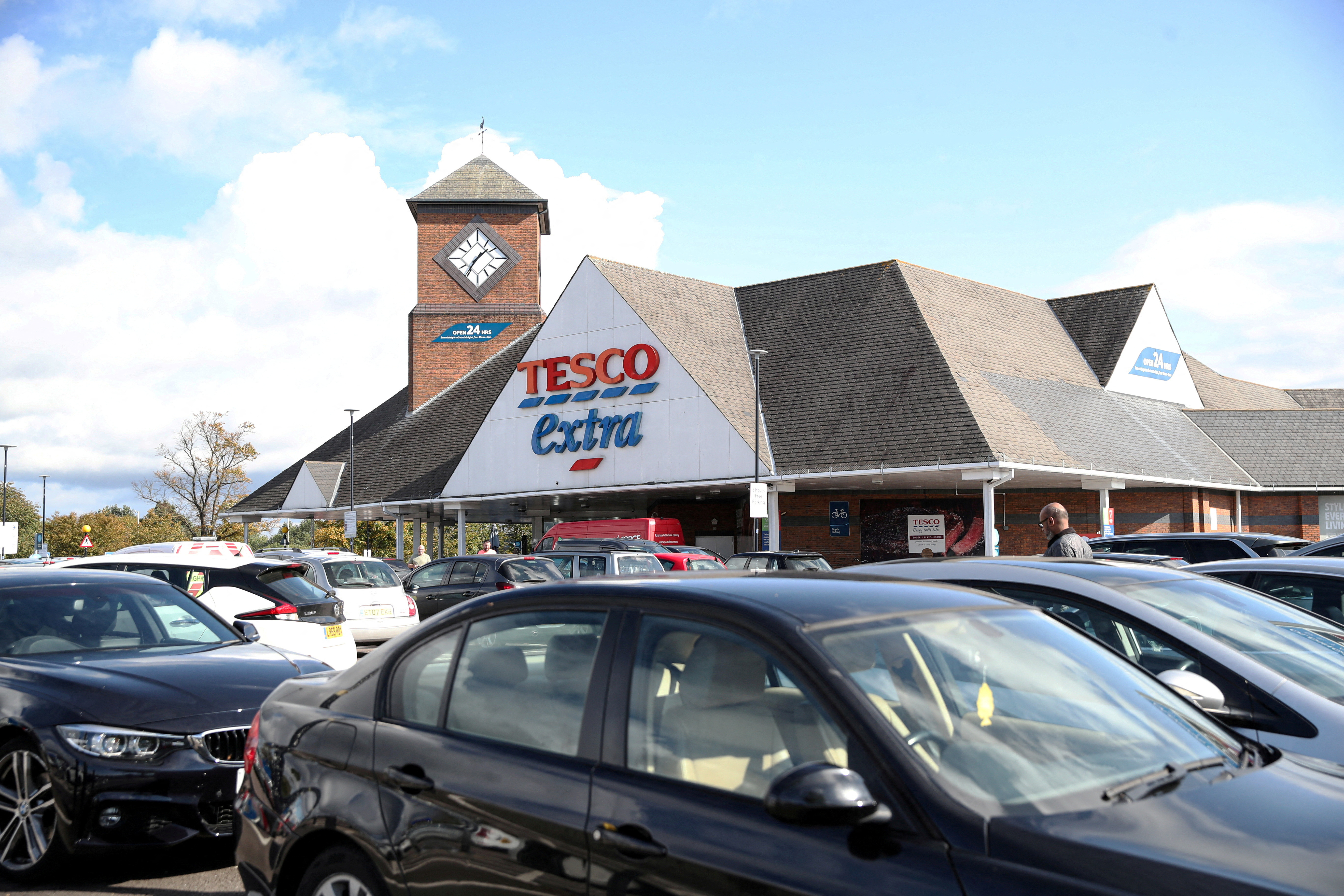 Vehicles are pictured outside a Tesco supermarket in Hatfield