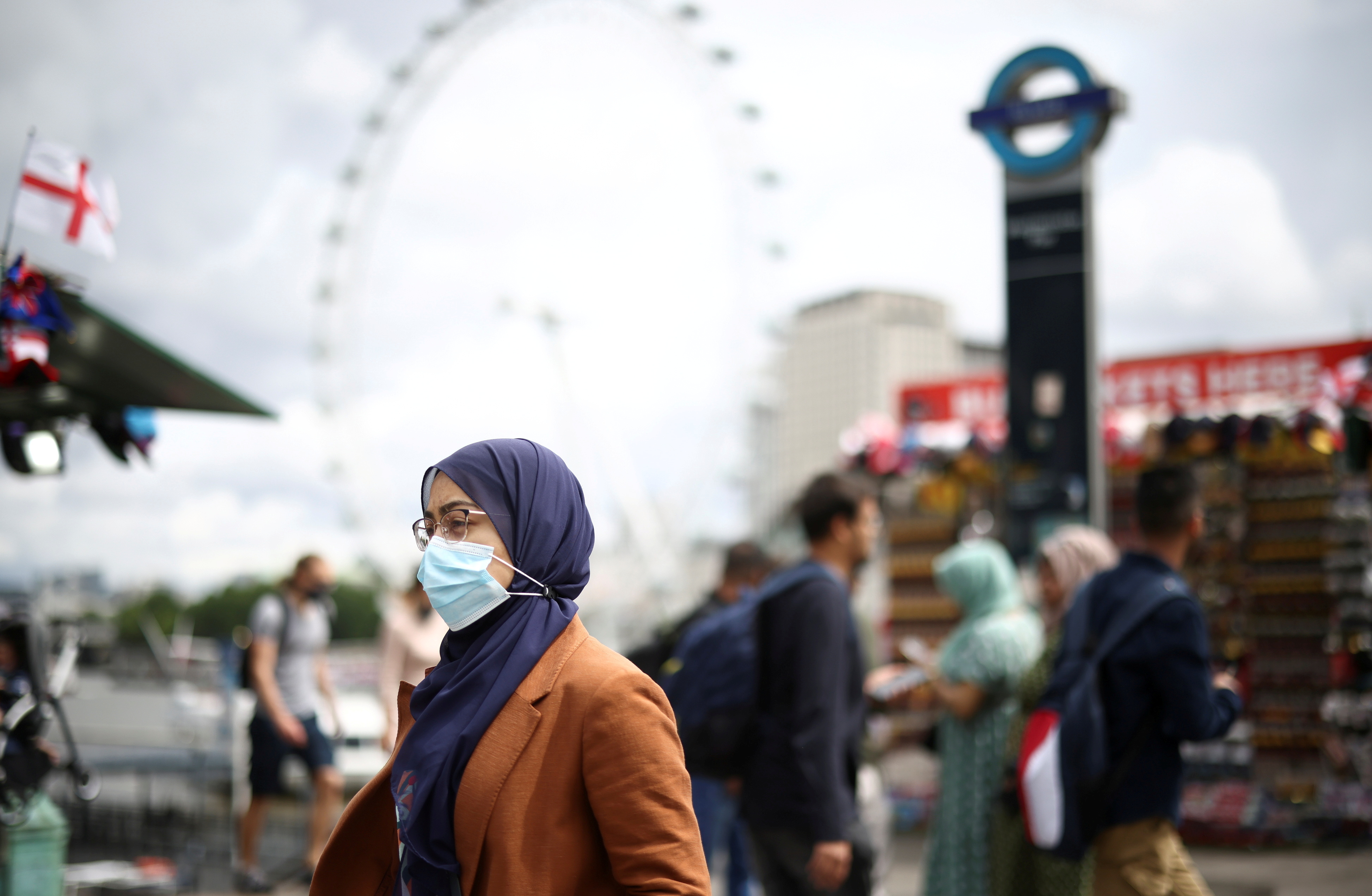 People walk over Westminster Bridge, amid COVID-19 pandemic, in London