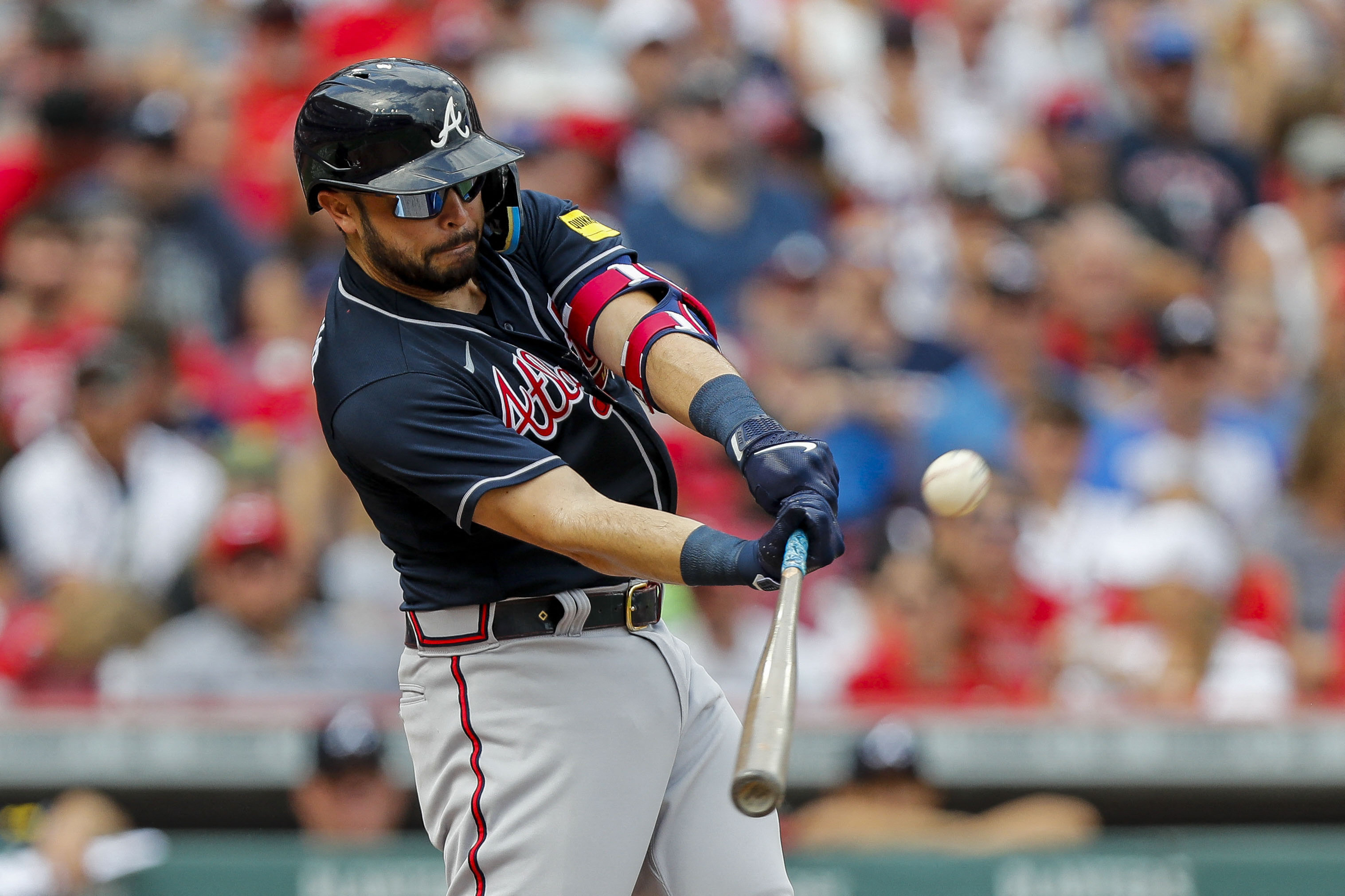 Braves end Reds' 12-game streak in thrilling slugfest