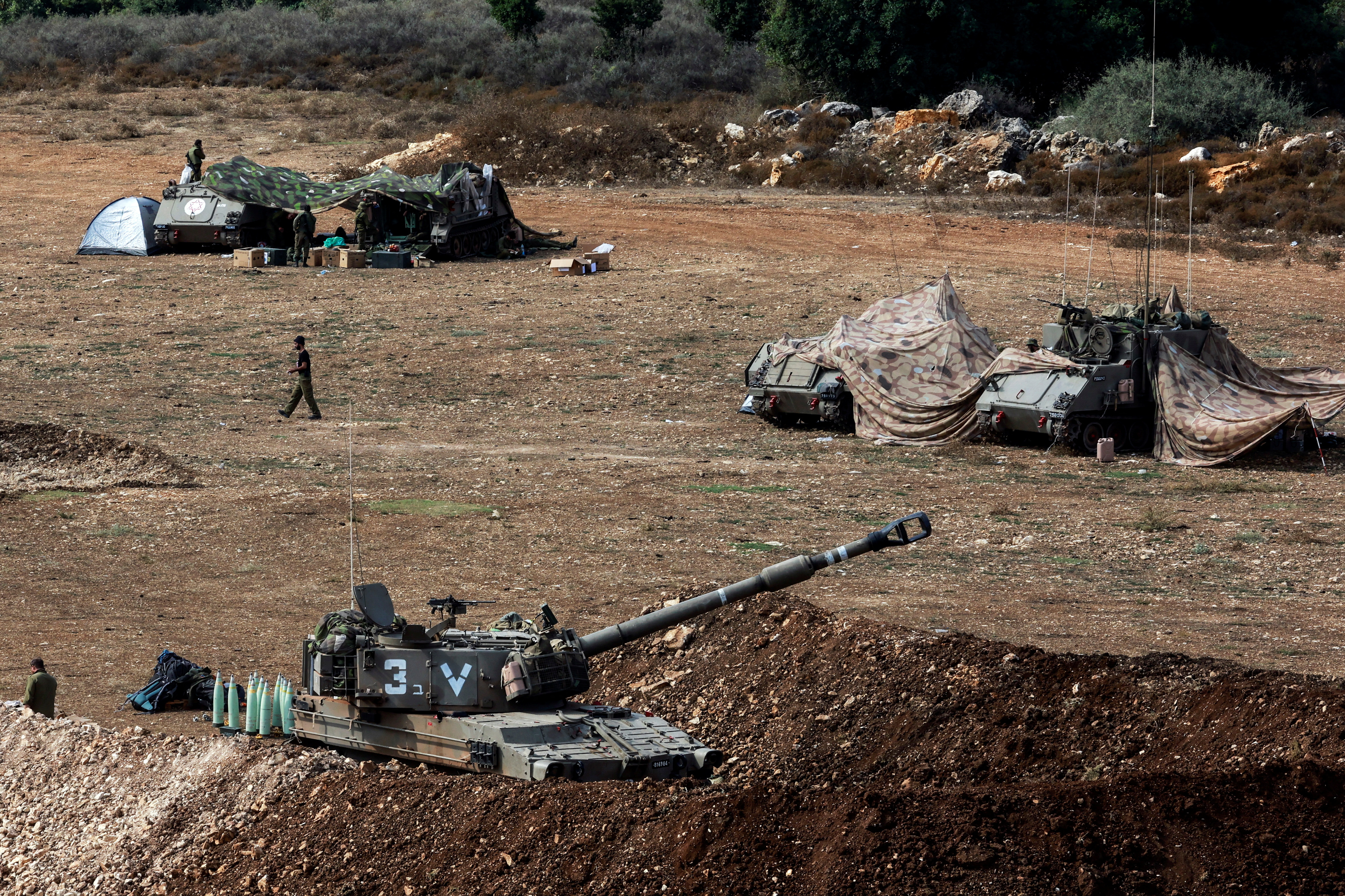 A view shows an Israeli tank and military vehicles near Israel's border with Lebanon, northern Israel