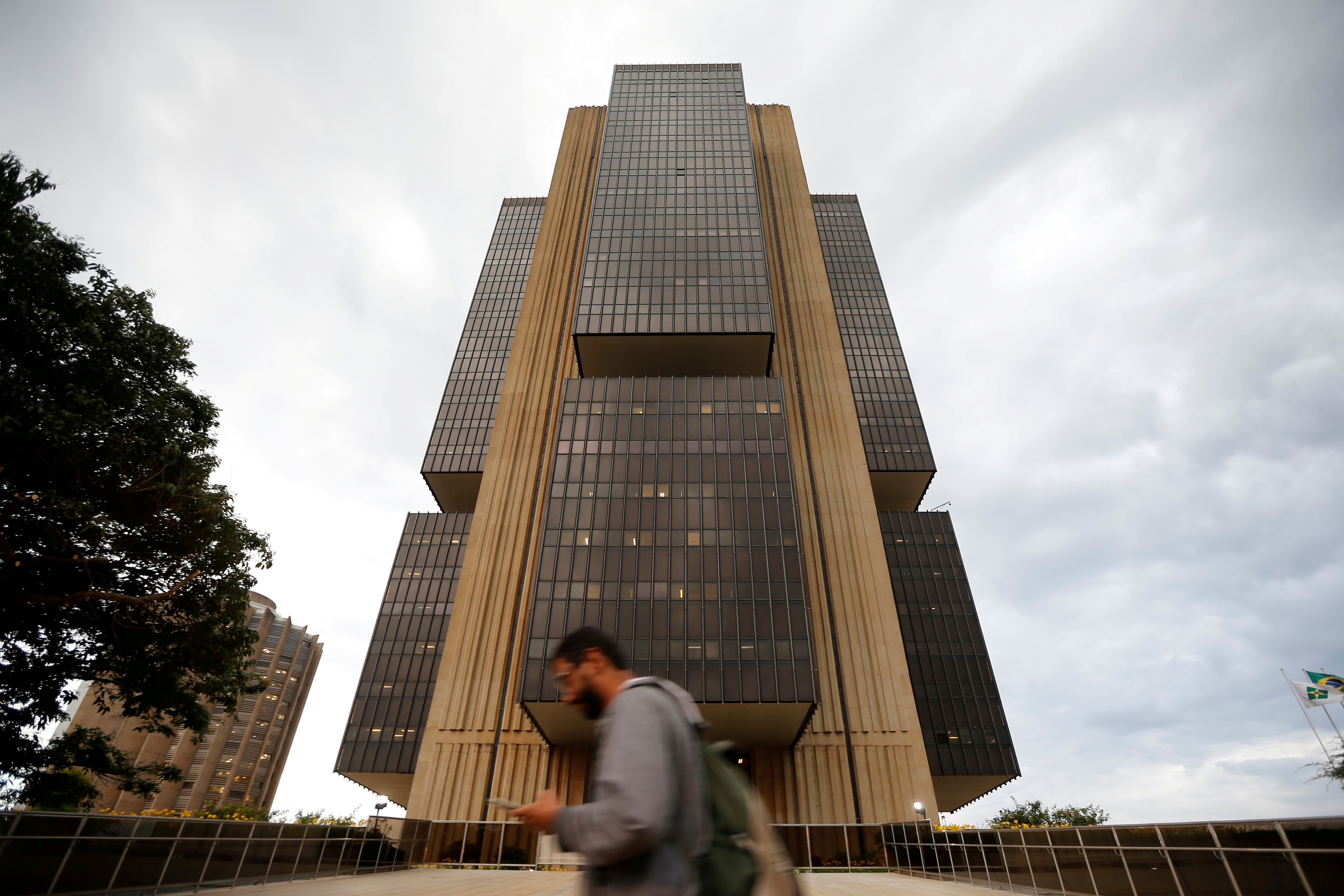 A man walks in front the Central bank headquarters building in Brasilia