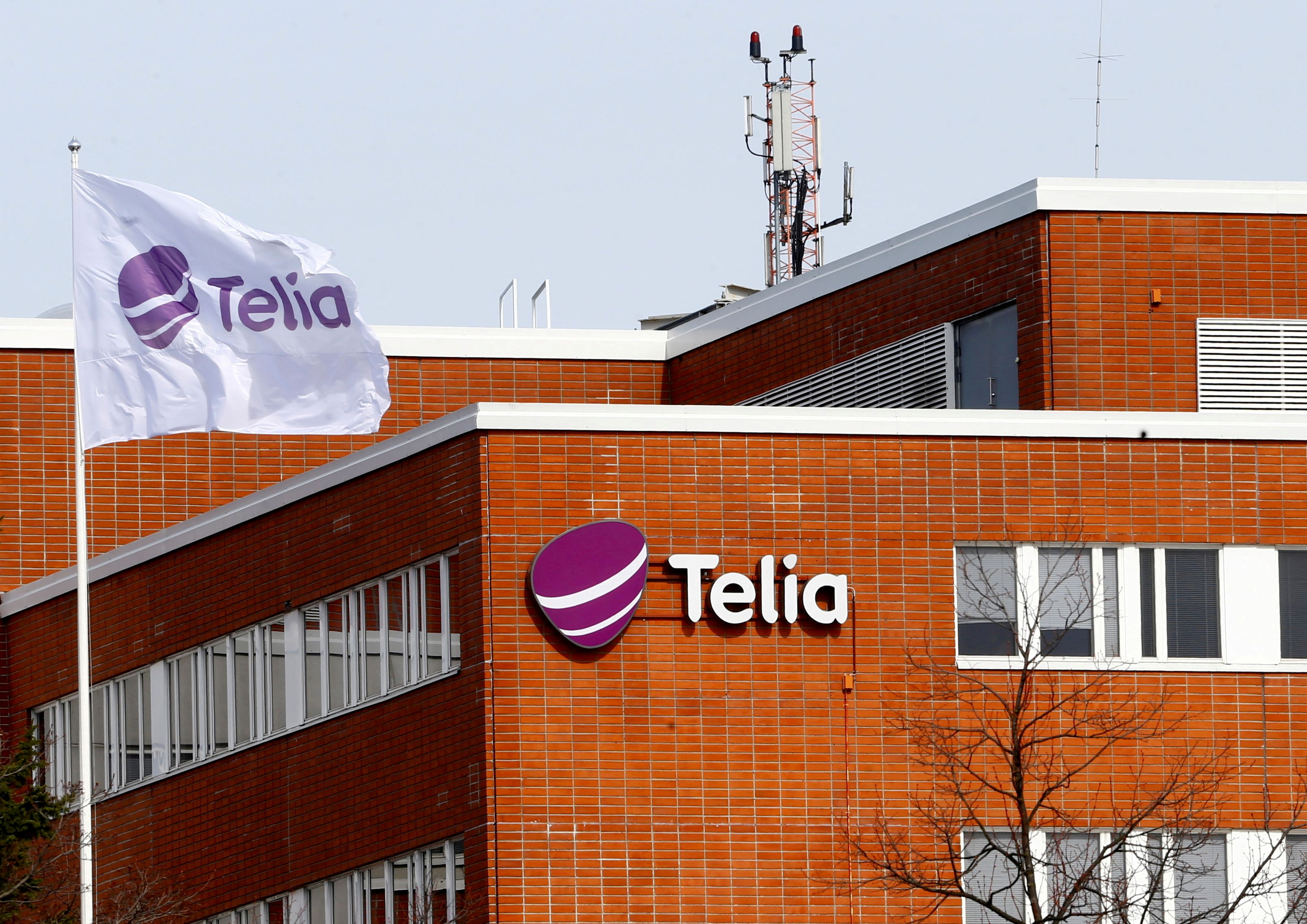 A flag flutters at the Telia offices in Helsinki