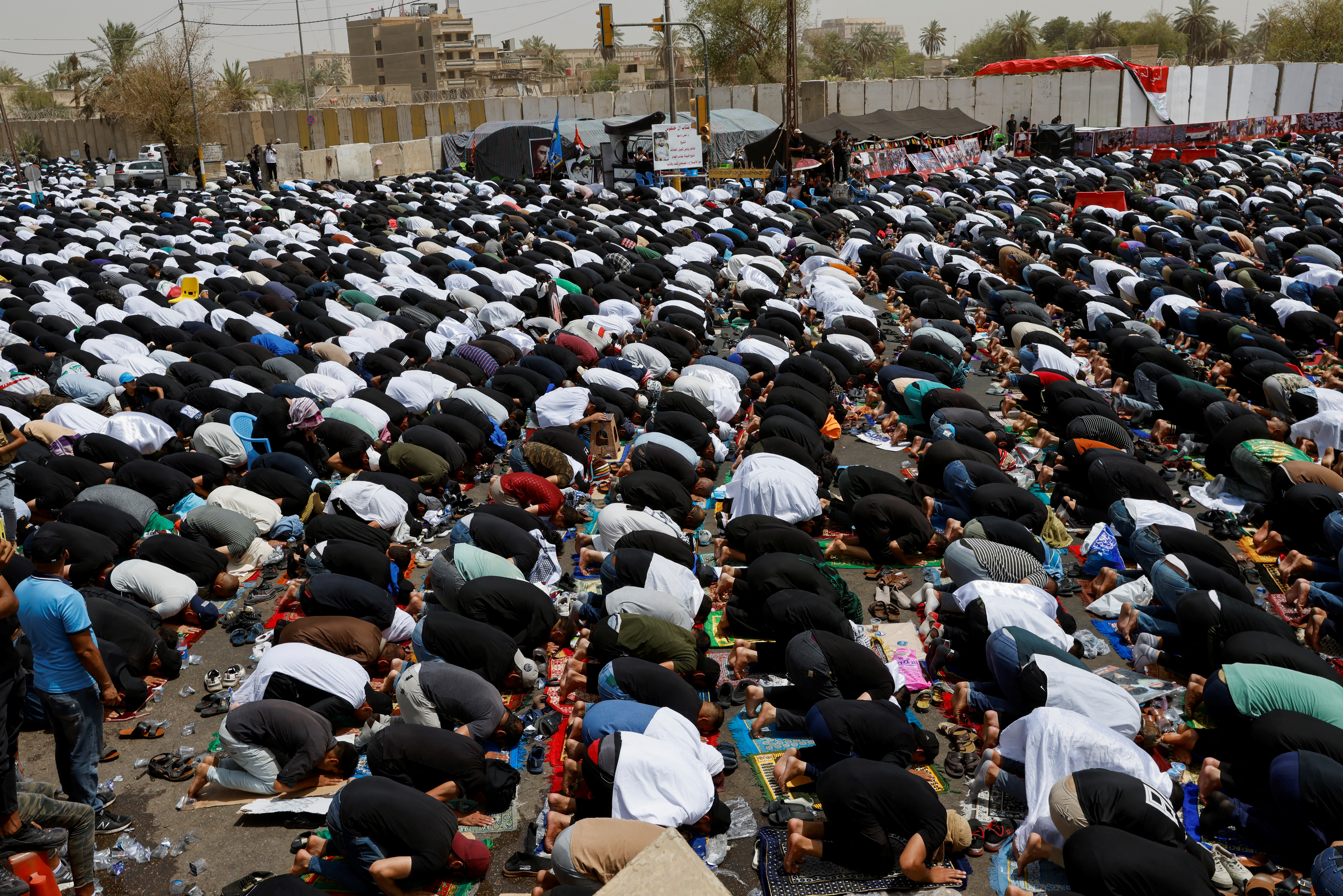 Supporters of Iraqi populist leader Moqtada al-Sadr gather for mass Friday prayer in front of parliament, in Baghdad