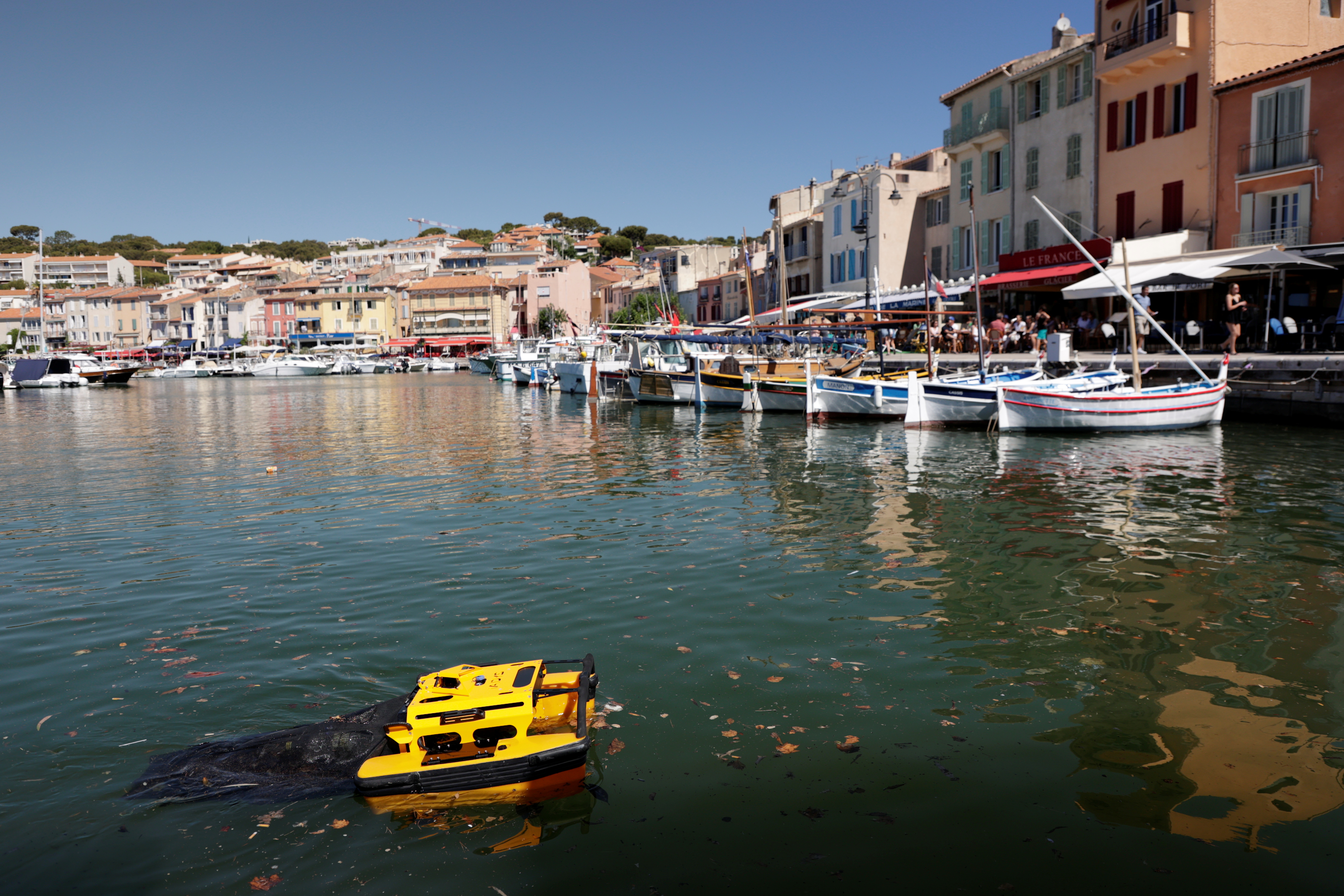The Jellyfish sea-cleaning remote-controled catamaran is seen at work in the port of Cassis