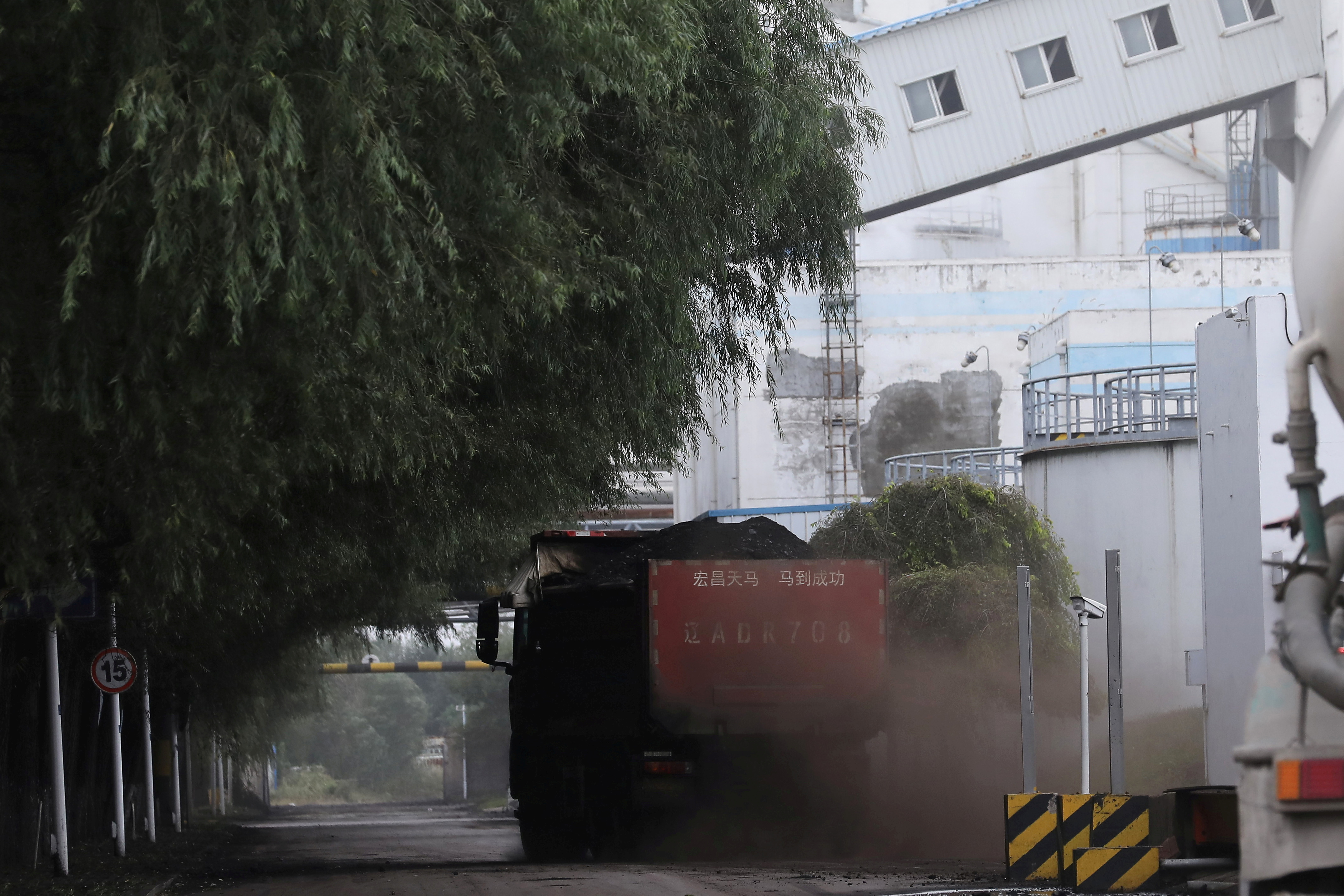 Truck transports coal at a coal-fired power plant in Shenyang, Liaoning
