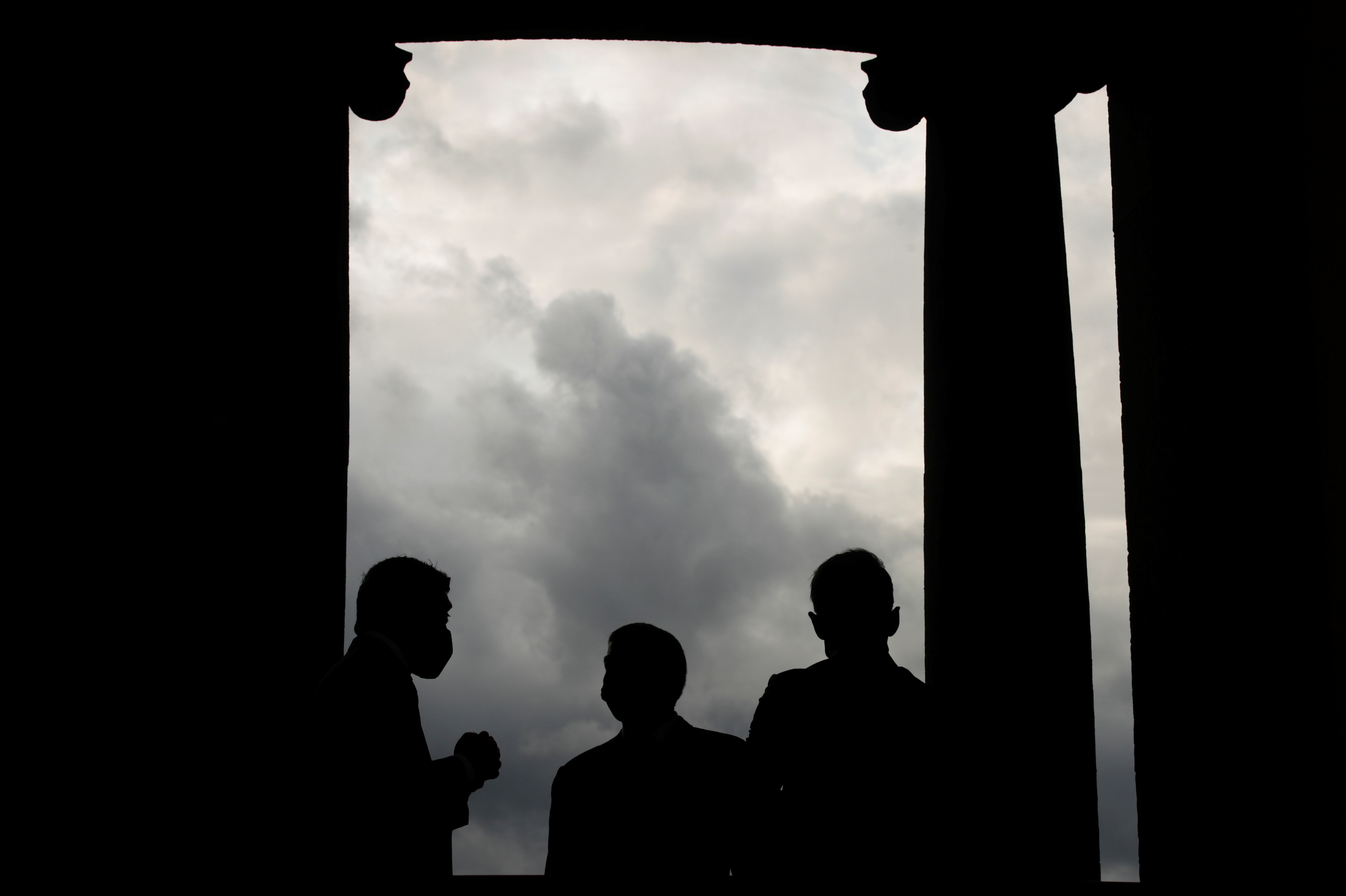 Silhouettes of UAE Foreign Minister Sheikh Abdullah bin Zayed al-Nahyan, his Israeli counterpart Gabi Ashkenazi and German Foreign Minister Heiko Maas are pictured before their historic meeting at Villa Borsig in Berlin