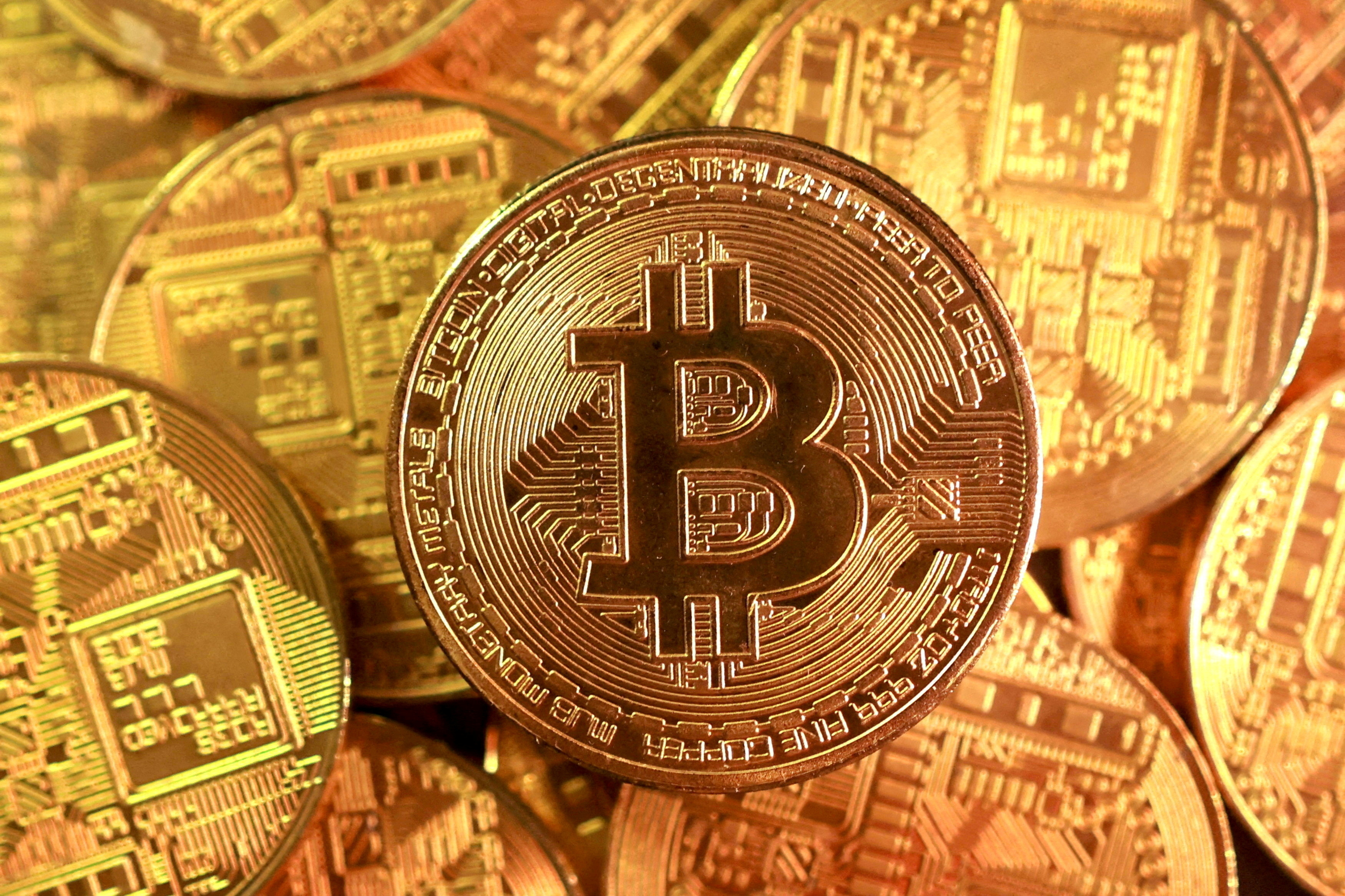 Bitcoin dips below $90,000 as AI worries dent risk appetite | Reuters