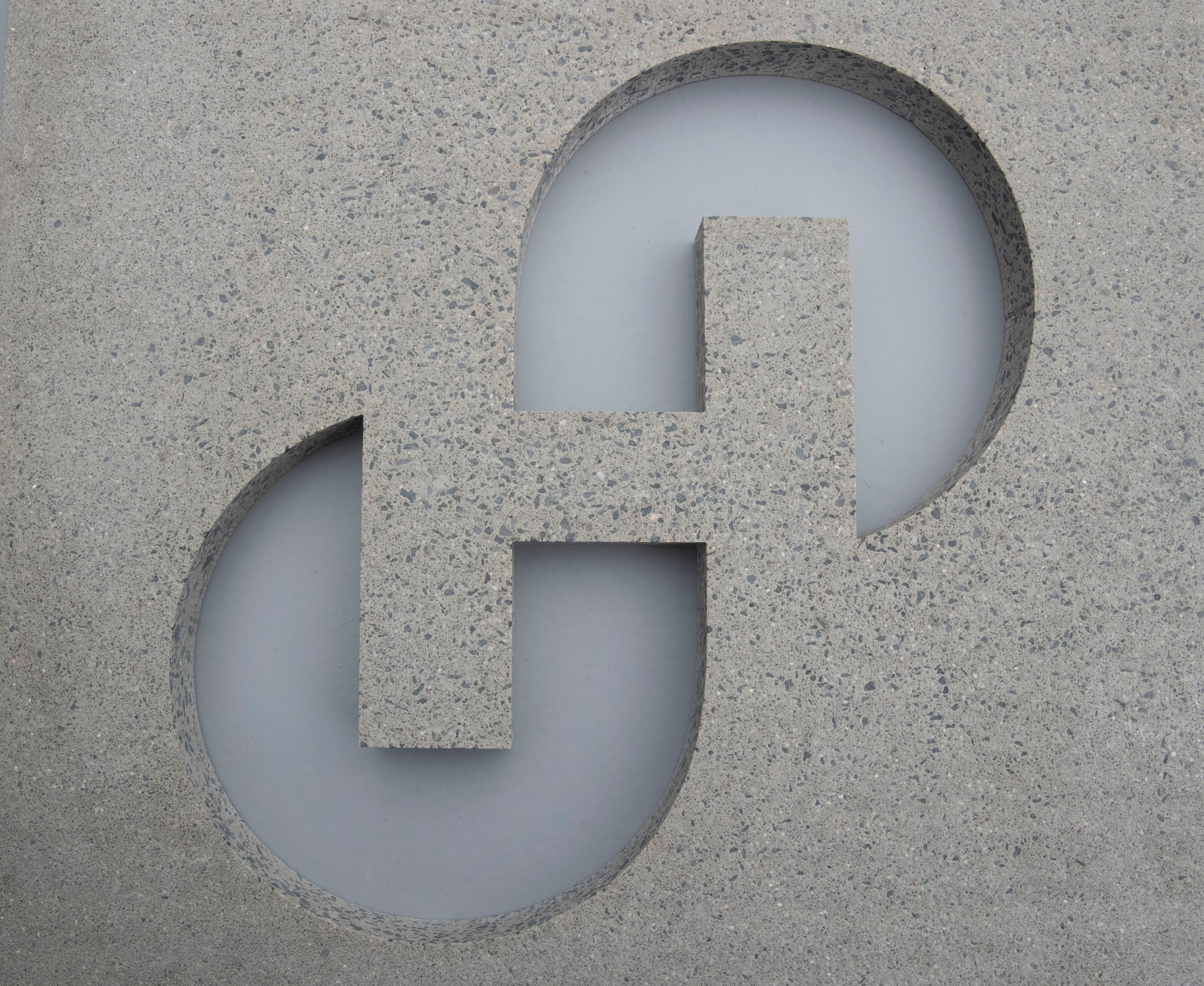 The new logo of Swiss cement maker Holcim is seen in a block of concrete during the Holcim Capital Markets Day event in Basel, Switzerland November 18, 2021. REUTERS/Arnd Wiegmann