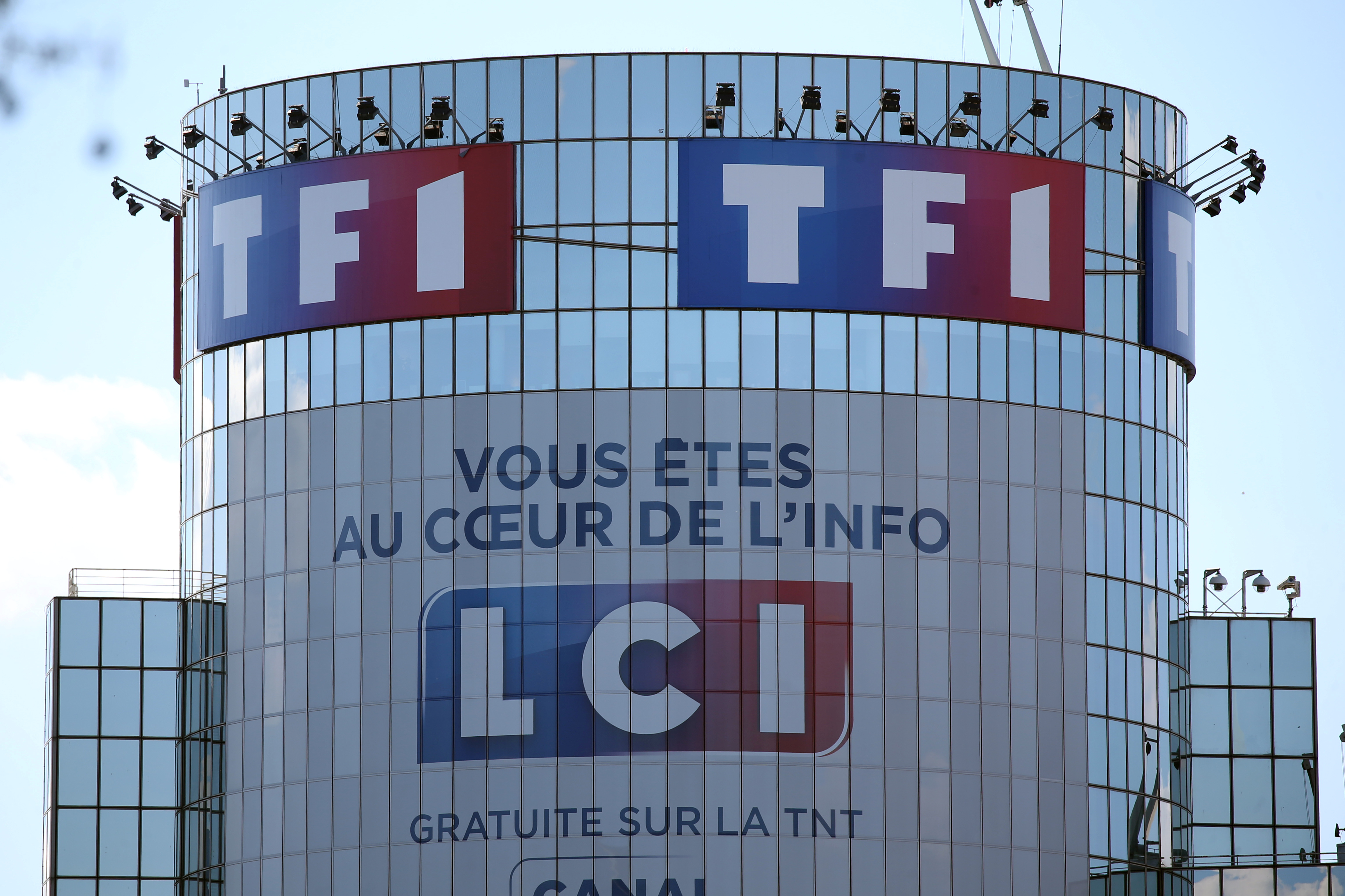 Logos of French television networks TF1 and LCI are seen at the Boulogne-Billancourt headquarters, near Paris