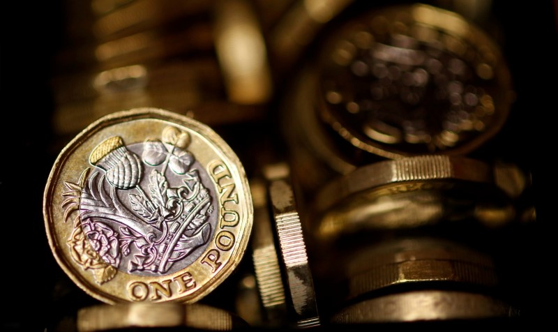 Pound coins are seen in this photo illustration taken in Manchester, Britain