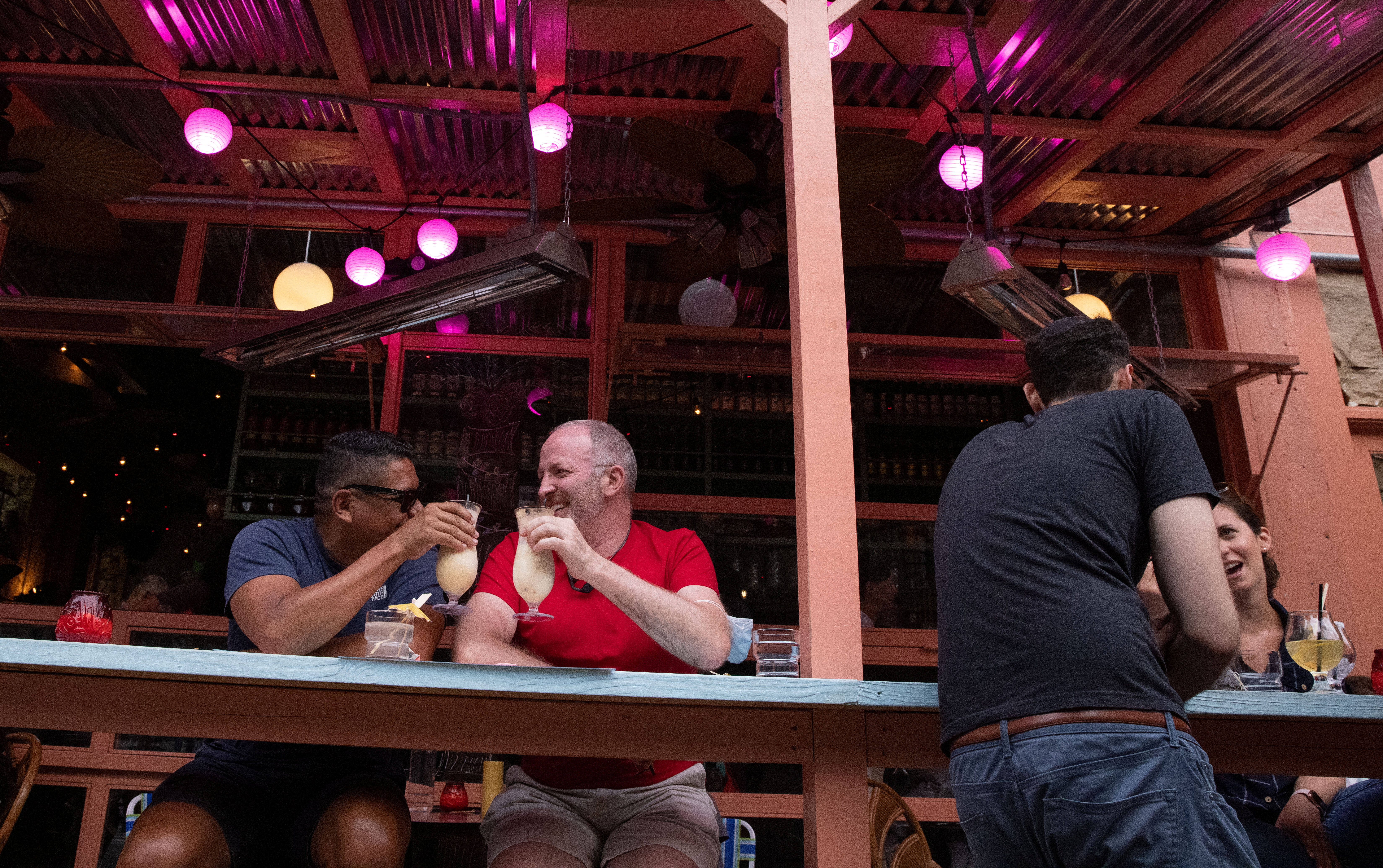 People eat at a restaurant in Manhattan, New York