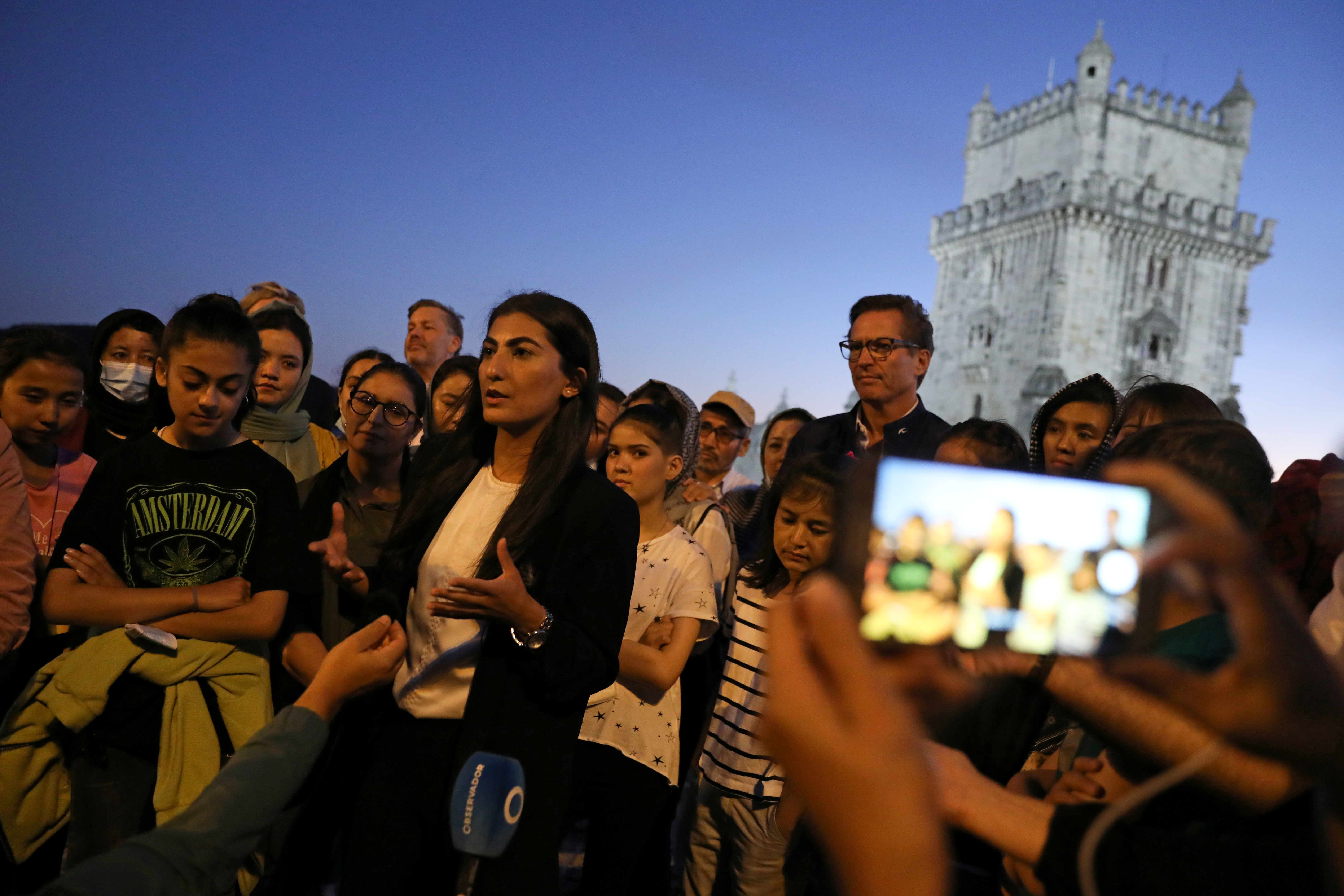 Captain of Afghanistan's national women's football team Muhtaj talks to the press at the Belem Tower in Lisbon