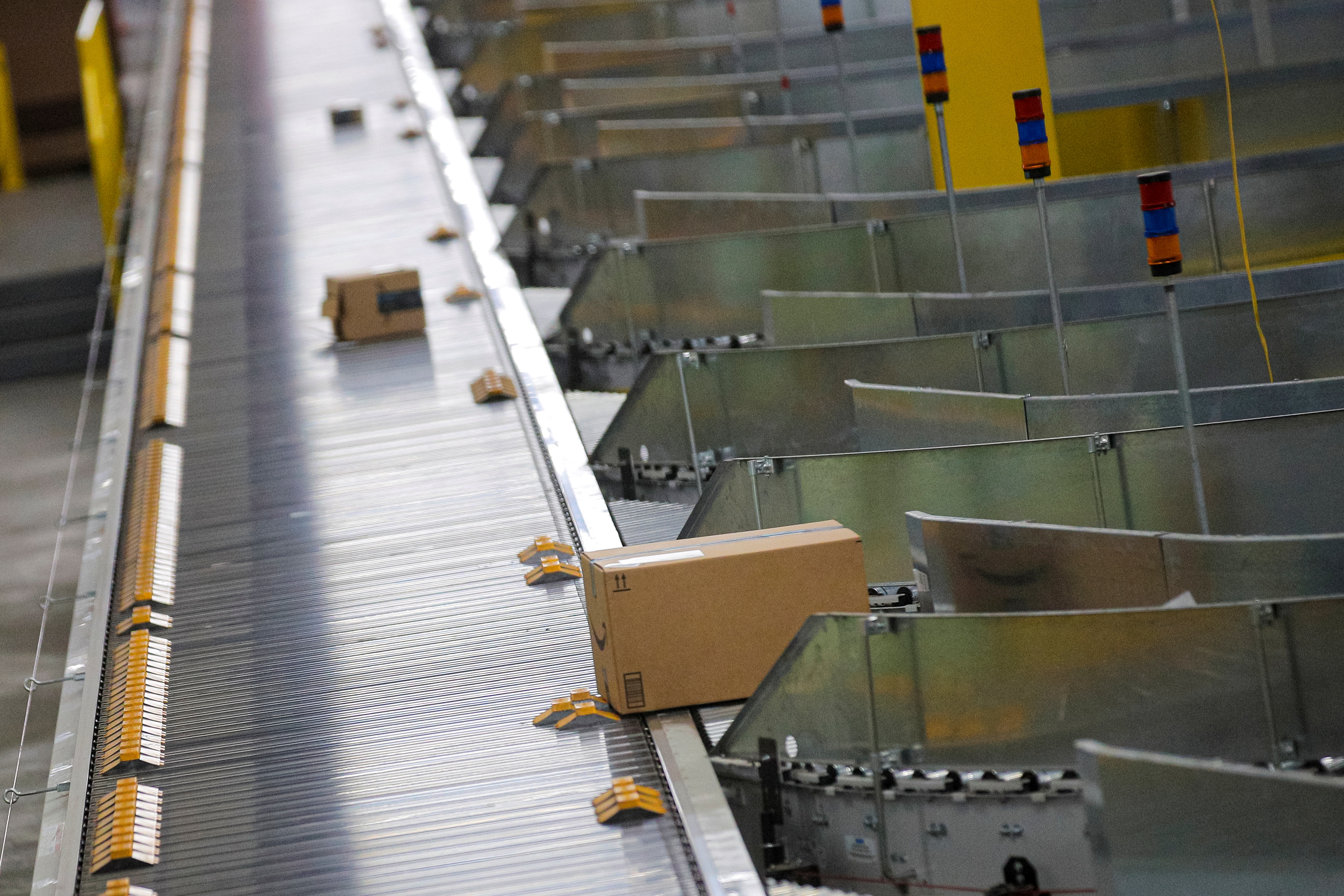 Packages are transported on a sorting machine inside Amazon's JFK8 distribution center in Staten Island, New York. REUTERS/Brendan McDermid.