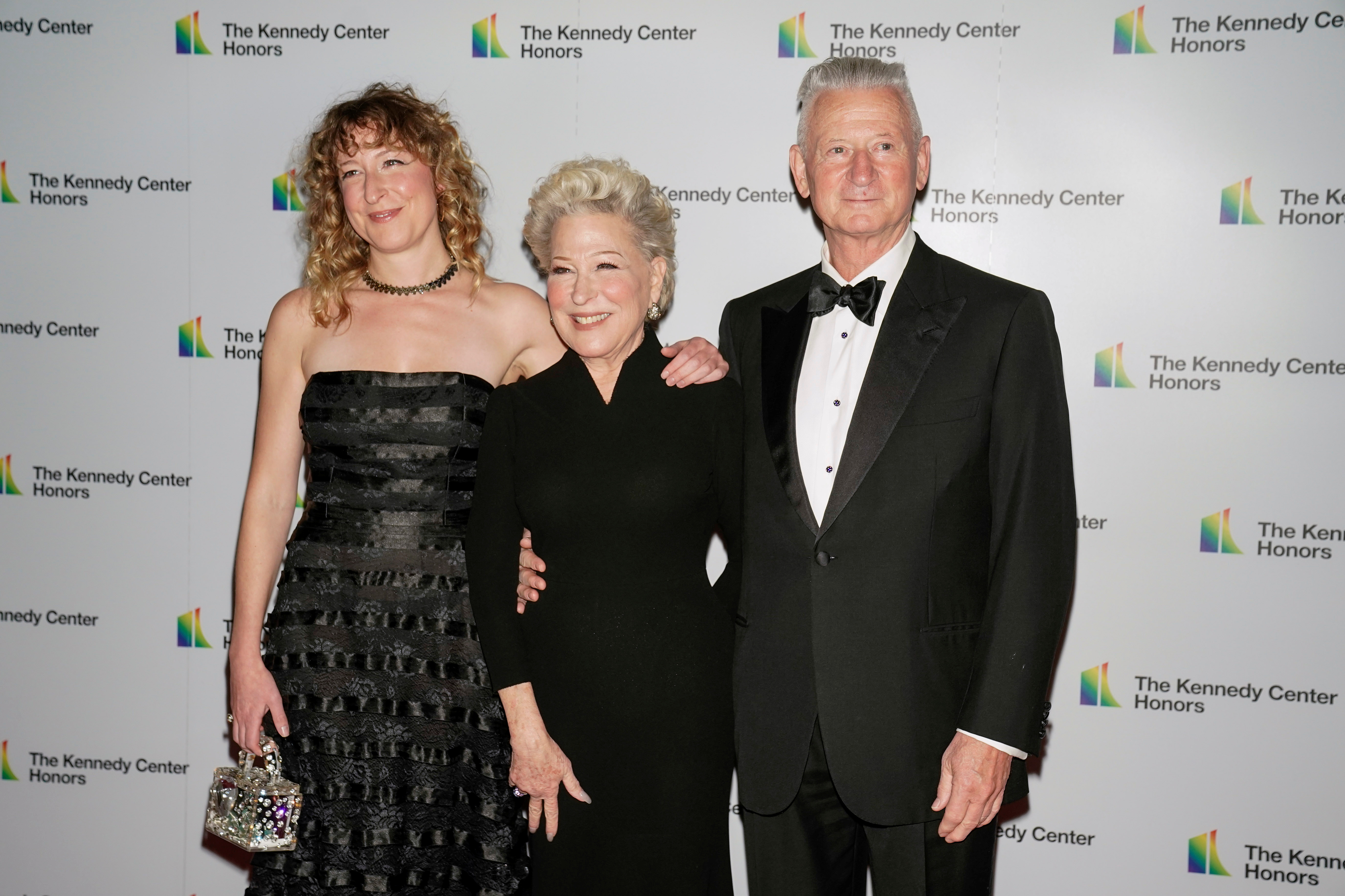 Kennedy Center Honoree, actress and singer-songwriter Bette Midler, daughter Sofie Haselberg and Martin von Haselberg pose on the red carpet as they attend The 44th Annual Kennedy Center Honors medallion ceremony at the Library of Congress in Washington, U.S., December 4, 2021. REUTERS/Ken Cedeno