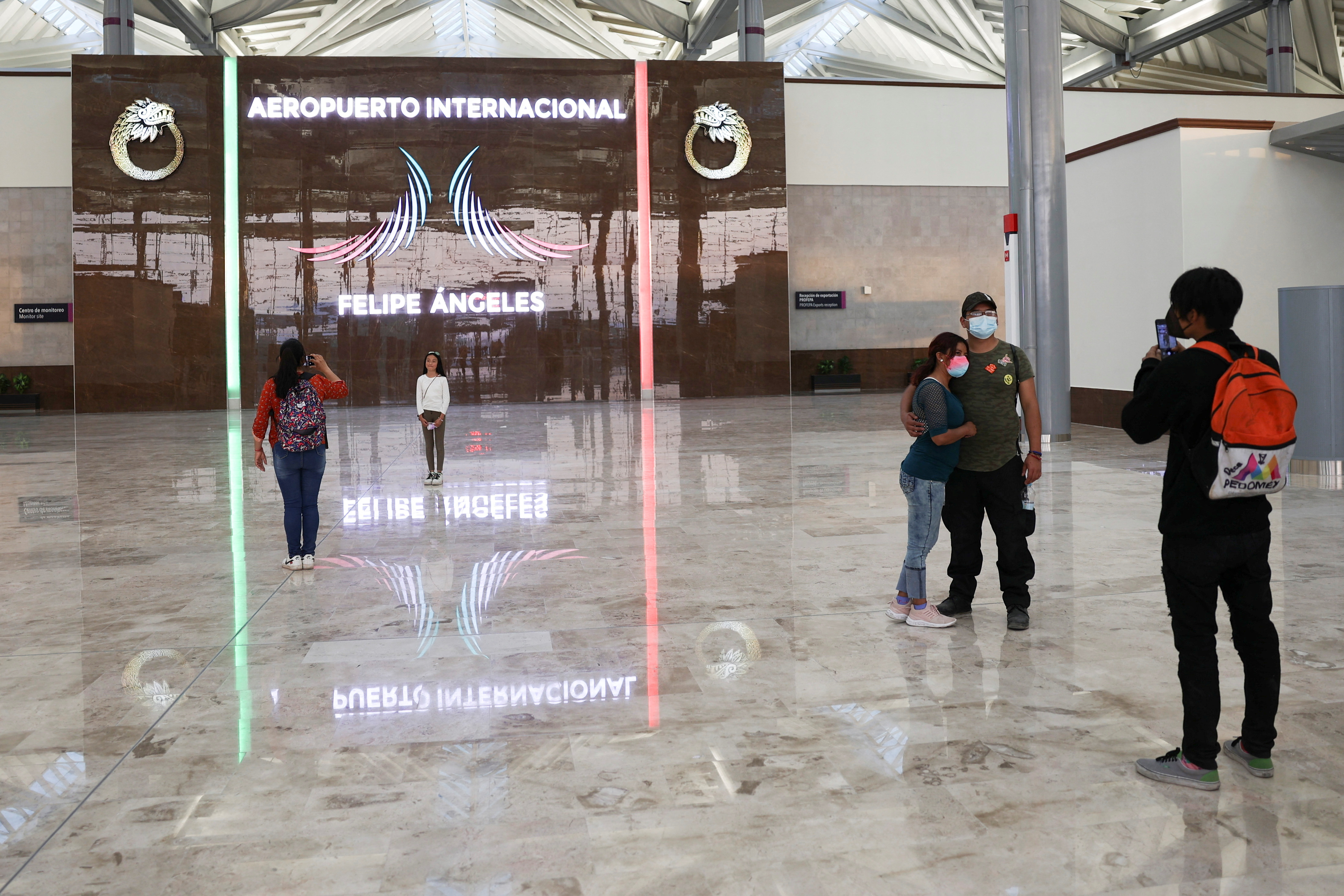 People take photos of themselves at an area of the new Felipe Angeles international airport, in Zumpango