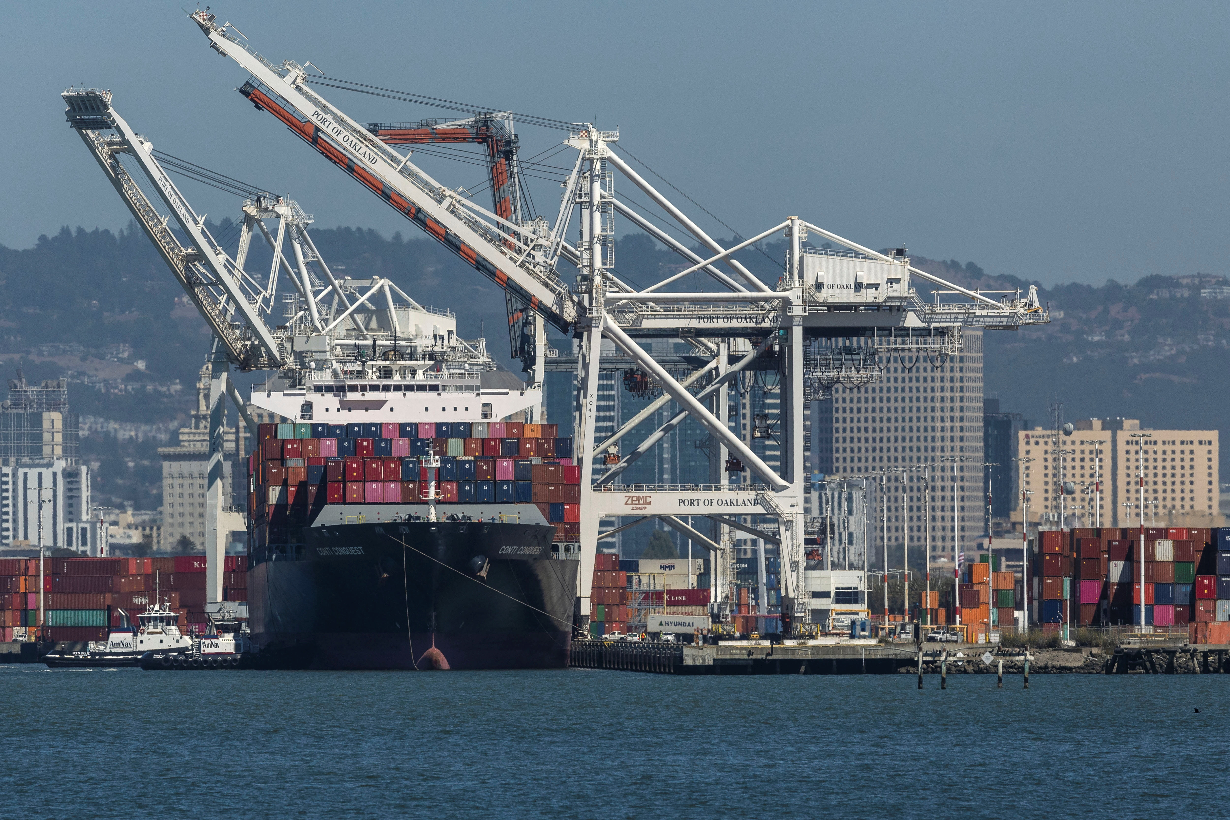 A cargo ship is seen at the port of Oakland, California