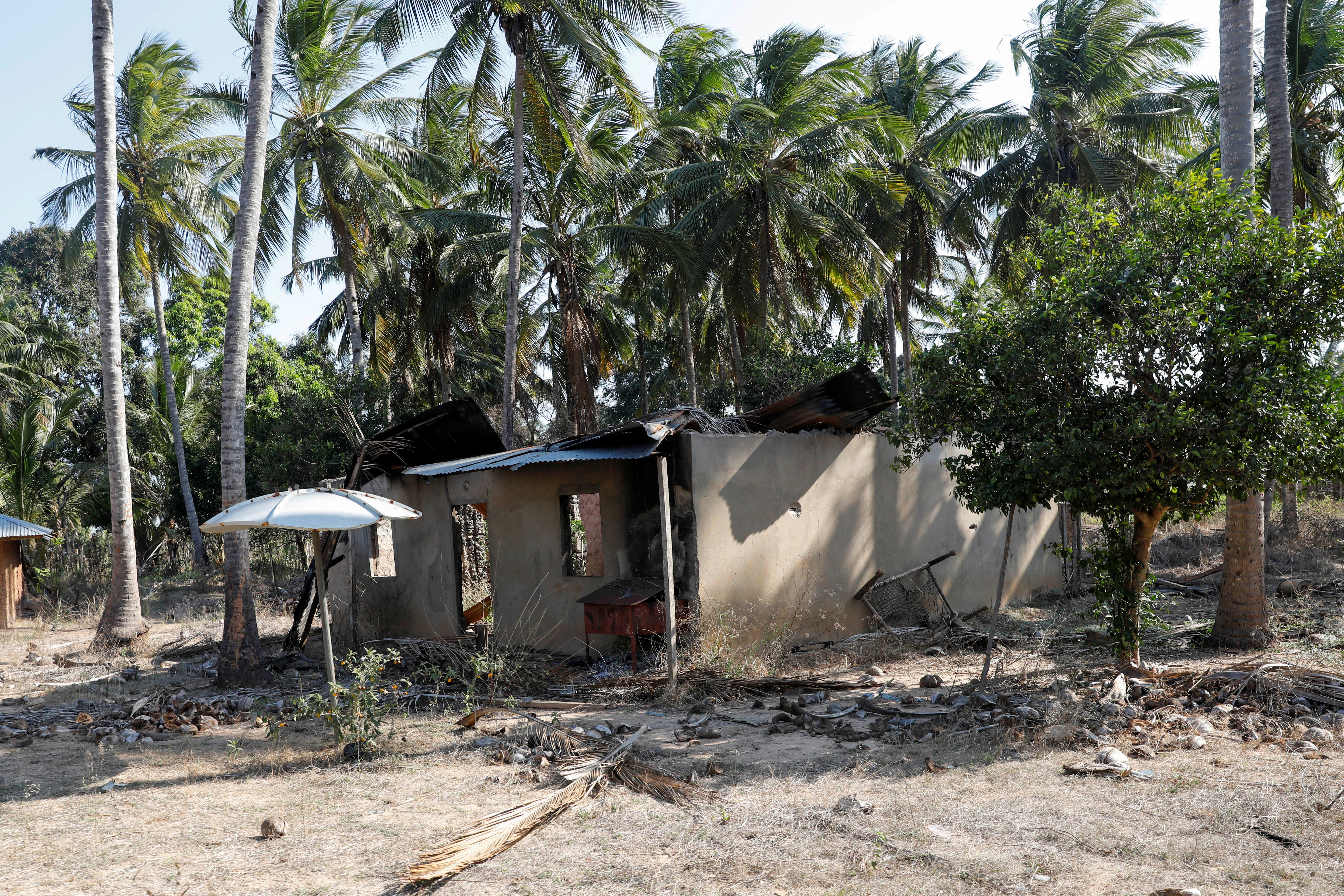 A destroyed house is pictured in the town of Mbau