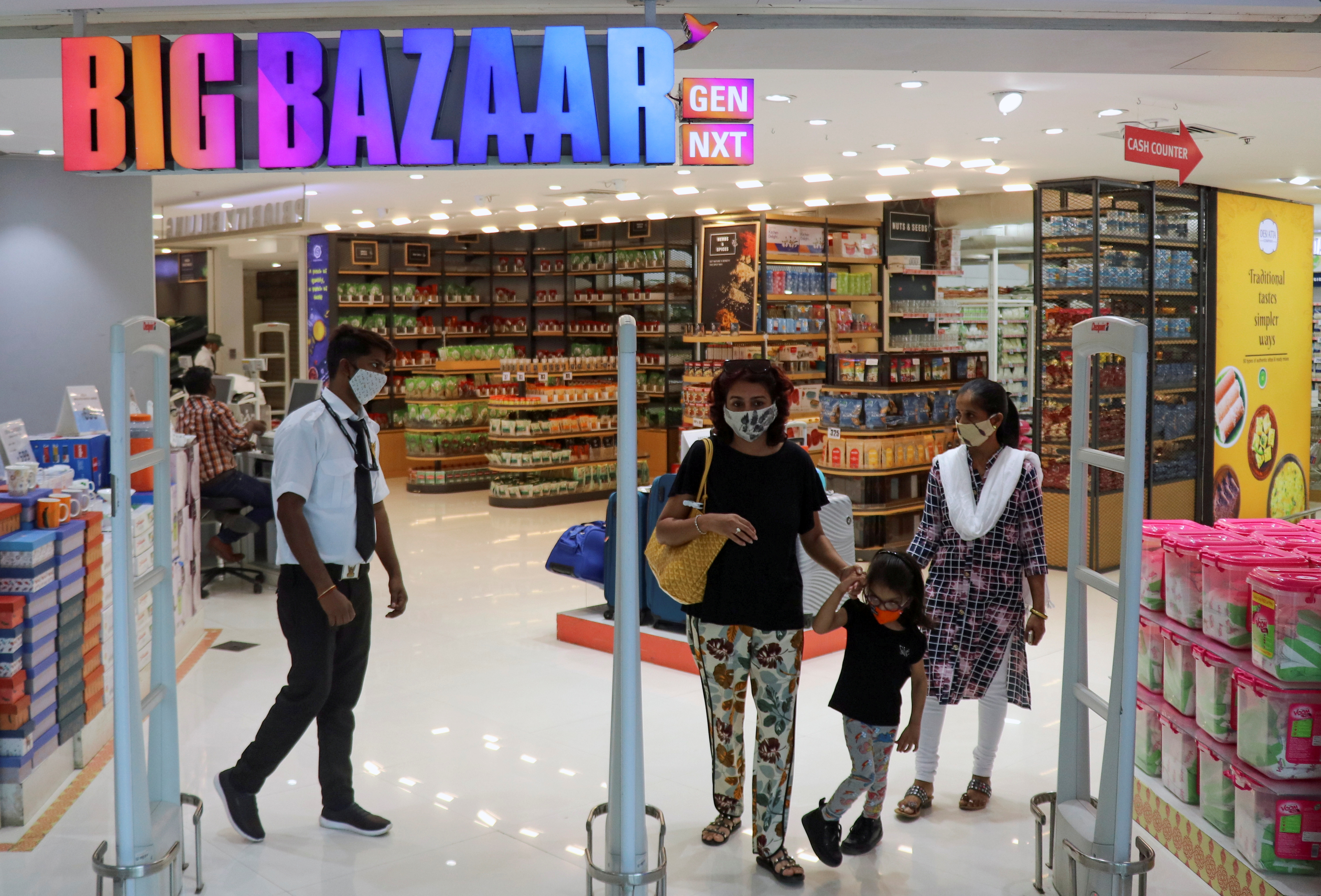 People exit the Big Bazaar retail store in Mumbai, India, November 25, 2020. REUTERS/Niharika Kulkarni/File Photo