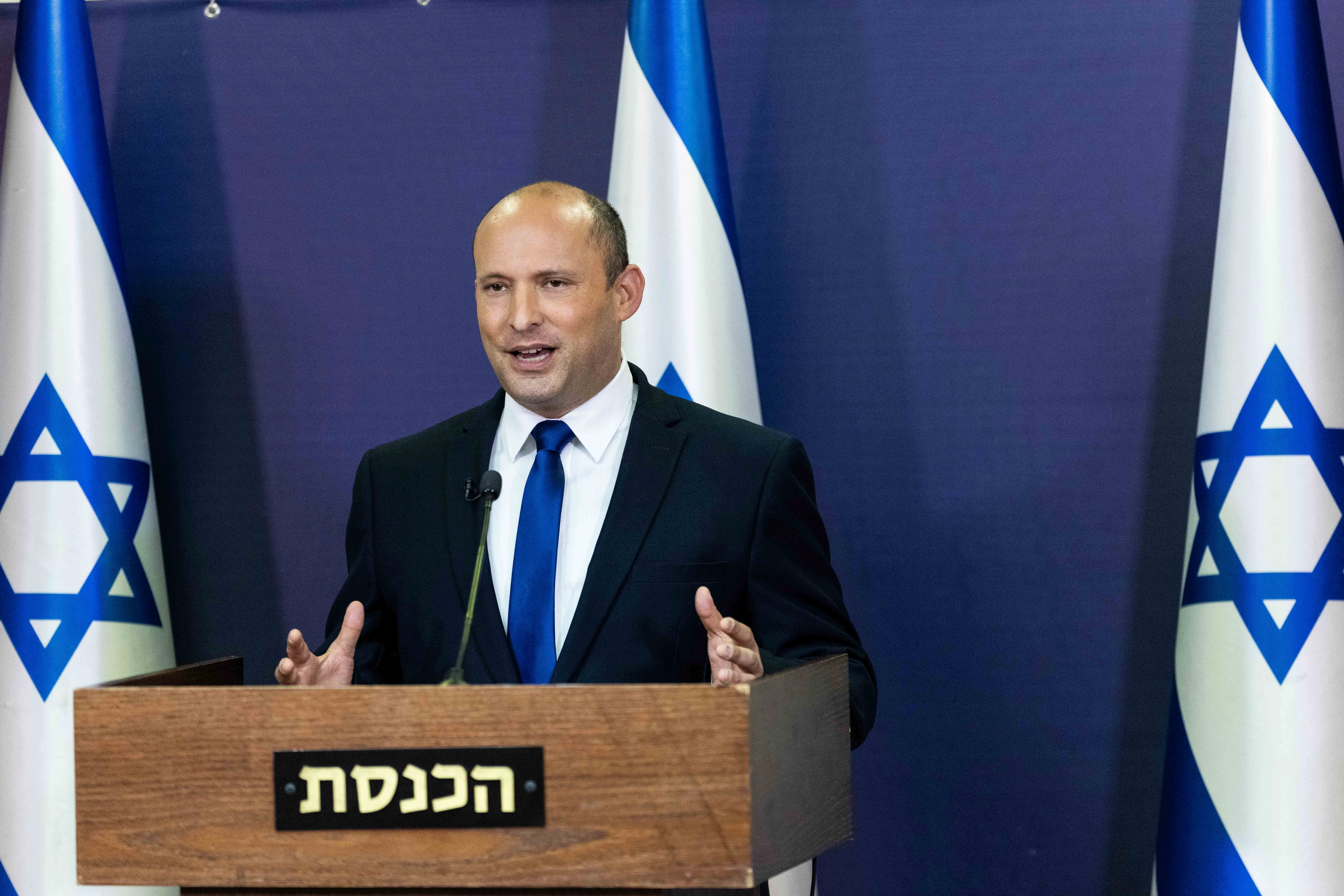 Leader of the Yamina party Naftali Bennett delivers a statement in the Knesset, the Israeli Parliament, in Jerusalem