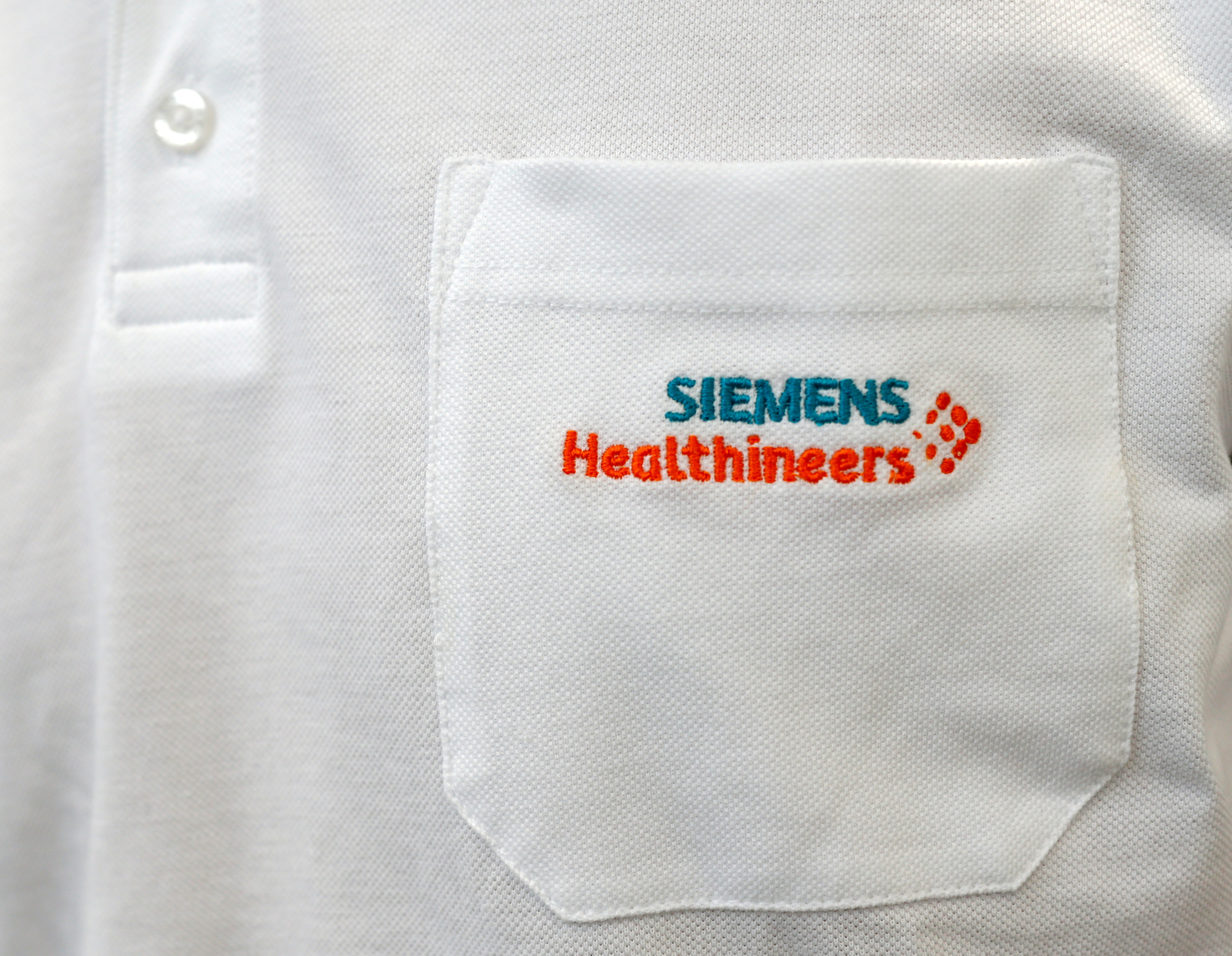 FILE PHOTO: Siemens Healthineers logo is seen on an item of clothing in manufacturing plant in Forchheim