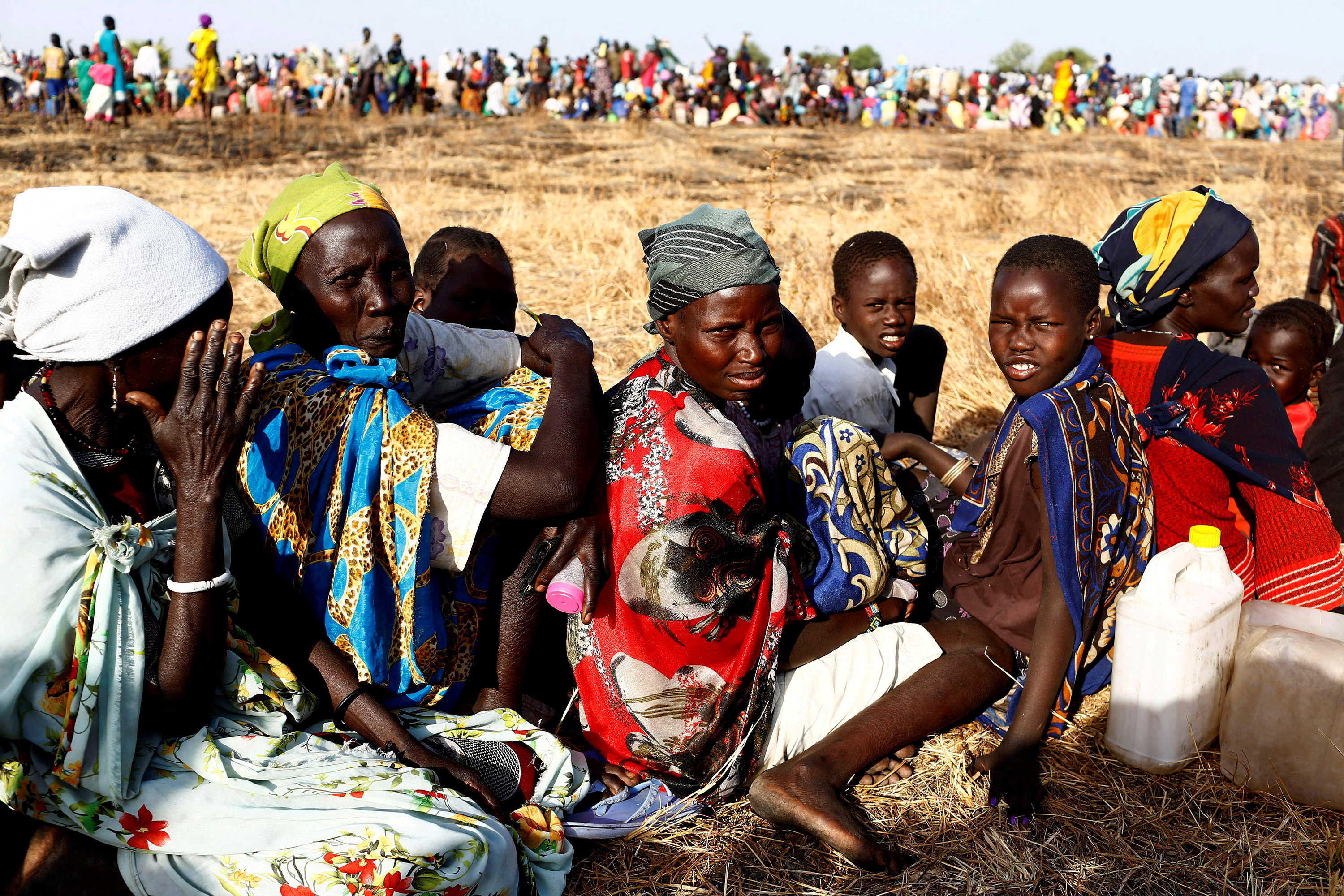 Women and children wait to be registered prior to a food distribution carried out by the United Nations World Food Programme (WFP) in Thonyor, Leer state, South Sudan