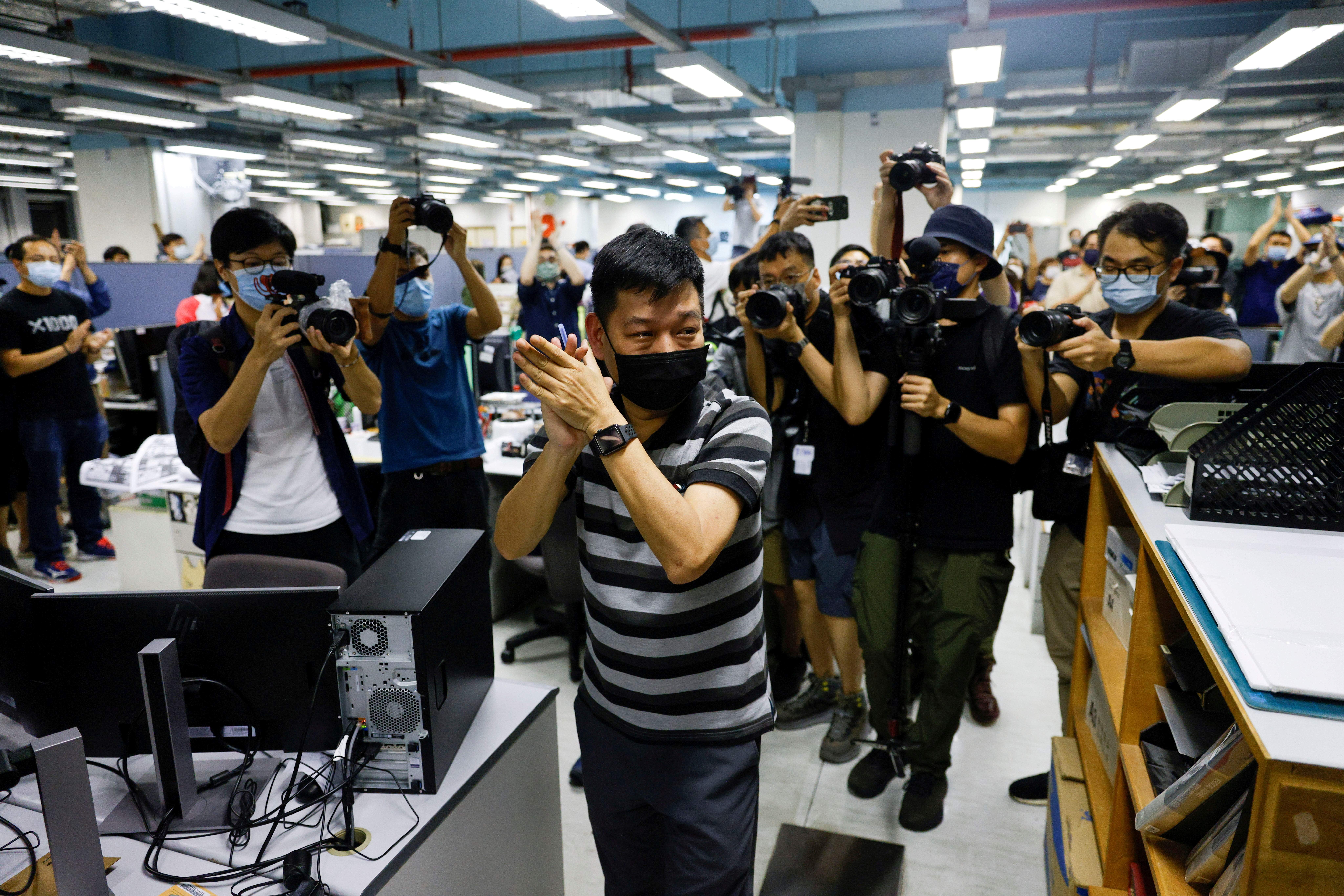 Staff members of Apple Daily work on their final edition in Hong Kong