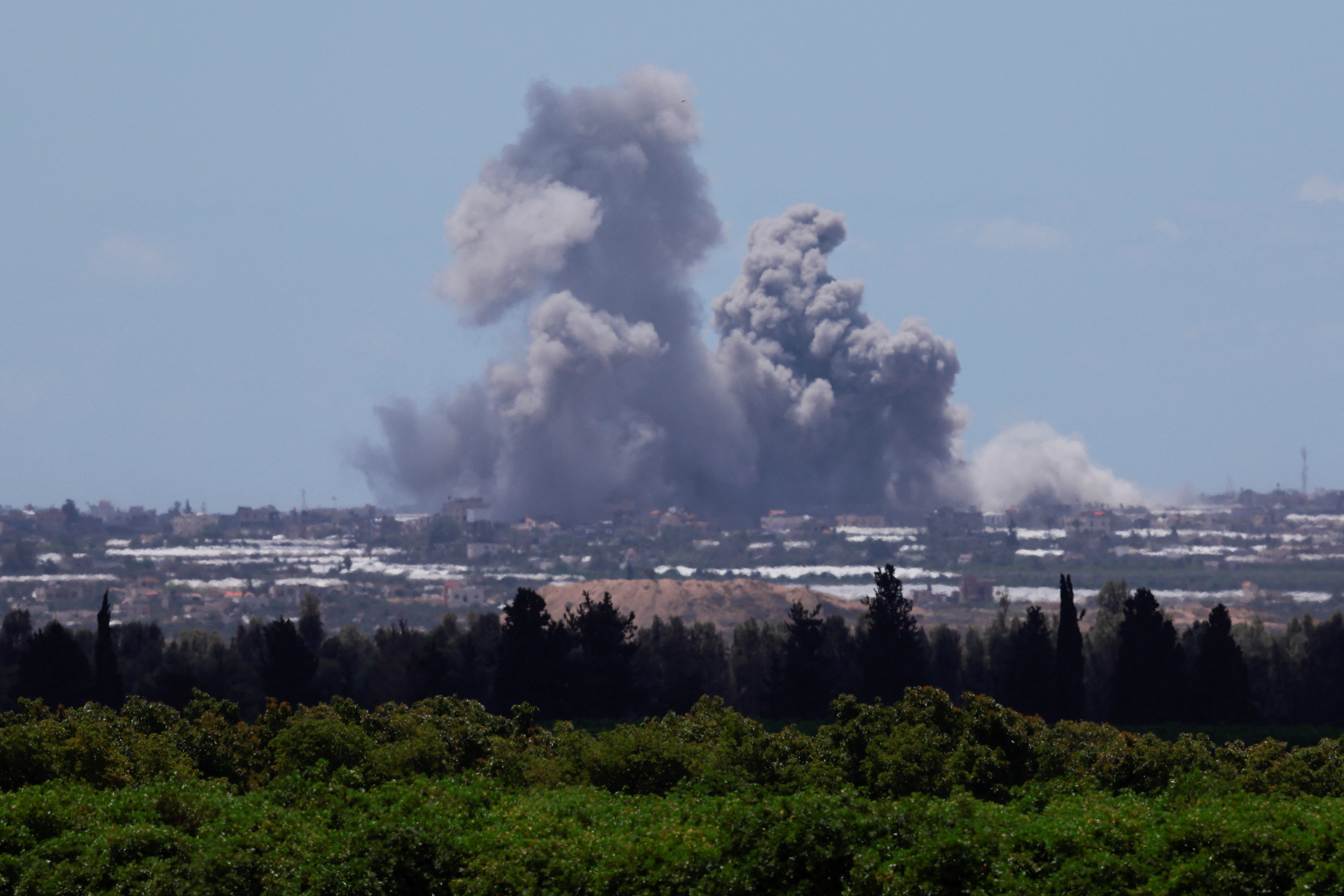 Smoke rises over Gaza following an explosion, amid the ongoing conflict between Israel and the Palestinian Islamist group Hamas, as seen from Israel