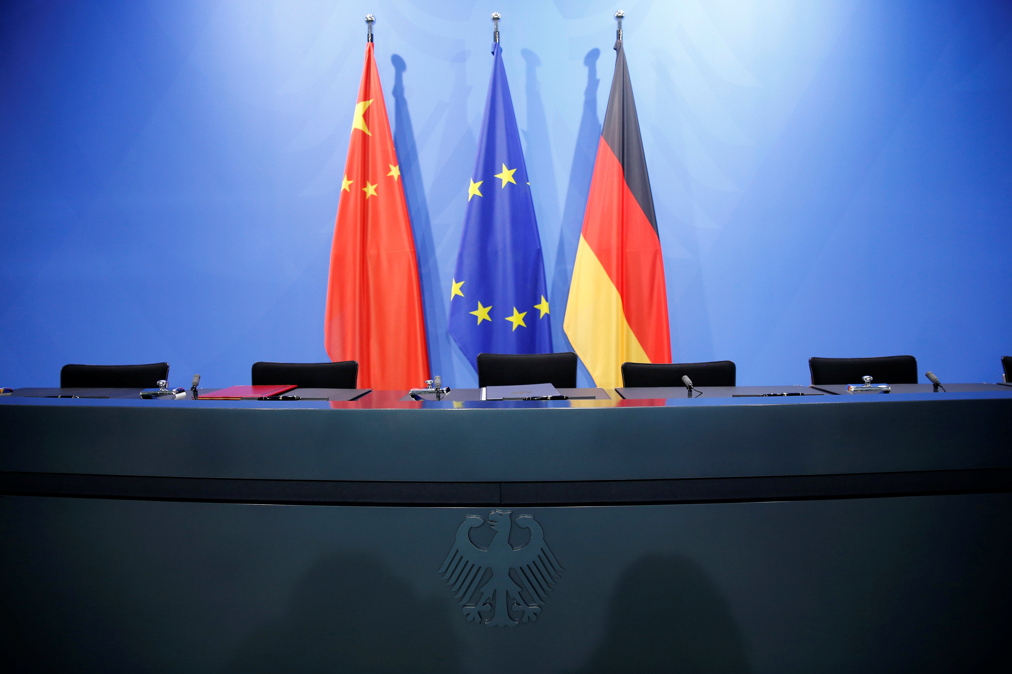 The Chinese, European Union (EU) and German national flags are pictured at the Chancellery in Berlin