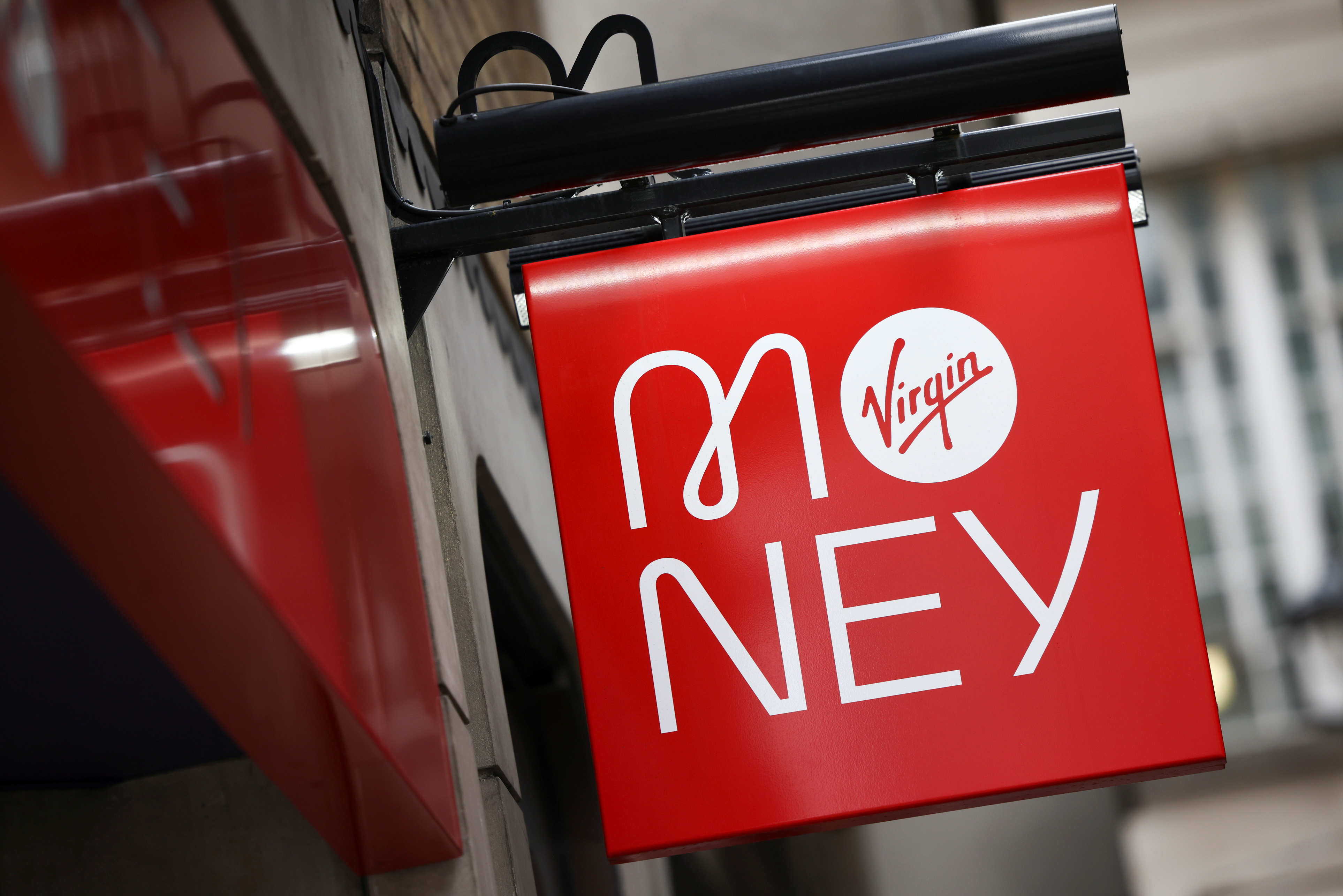 Signage on display outside of a Virgin Money store in central London