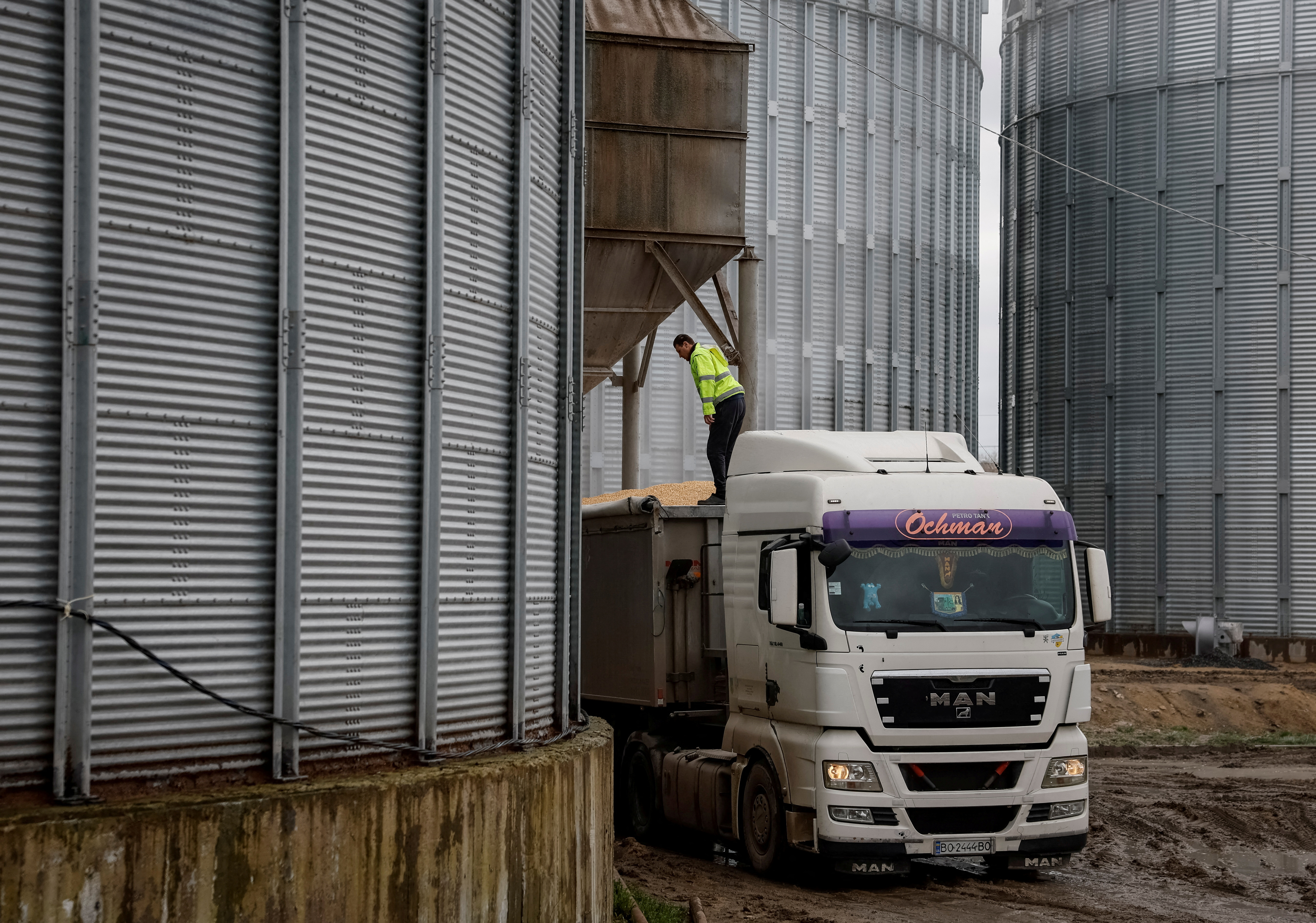 A truck filled with corn is seen at a grain storage facility in Bilohiria village