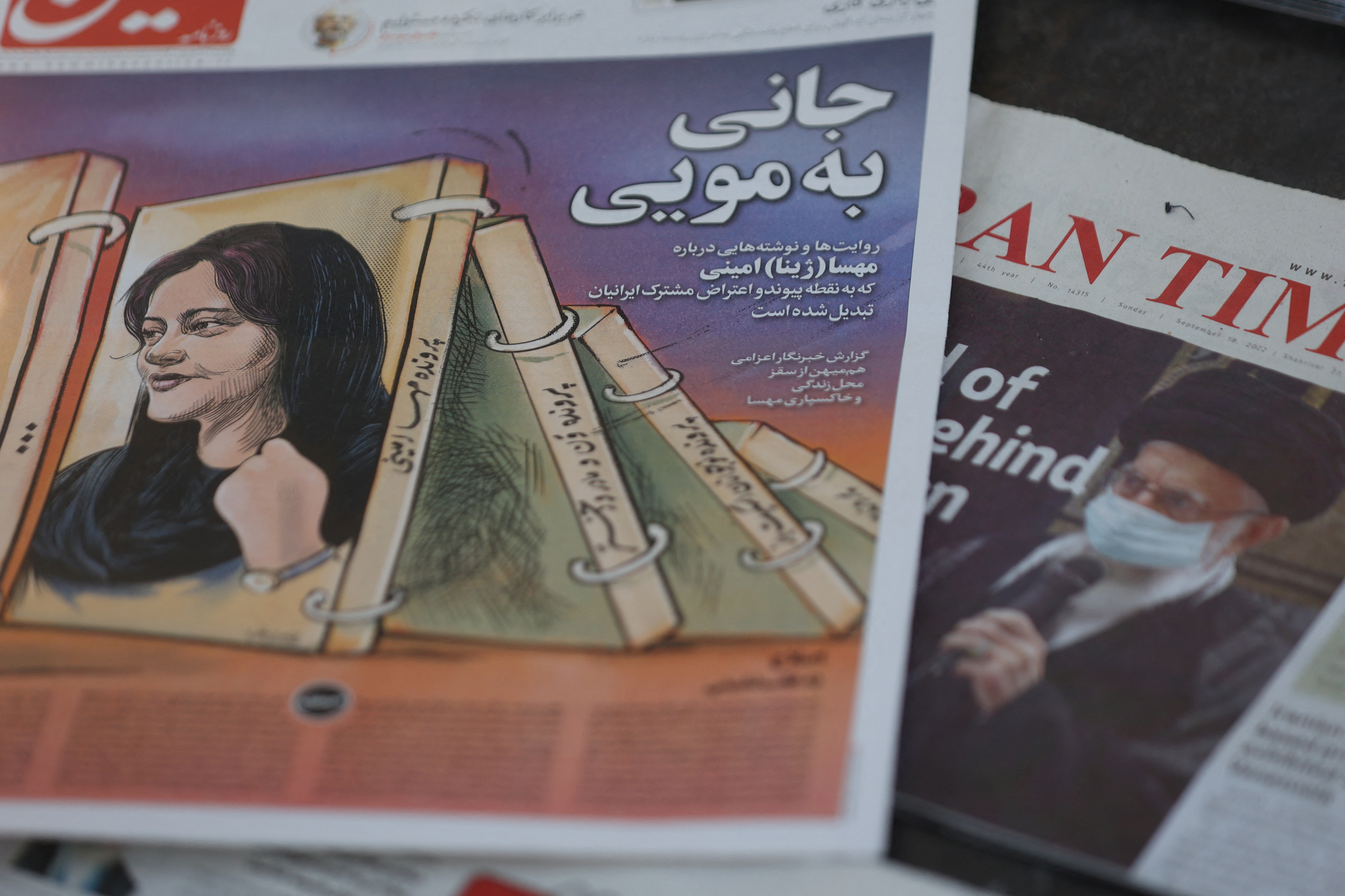 Newspapers with Amini, a victim of country's 