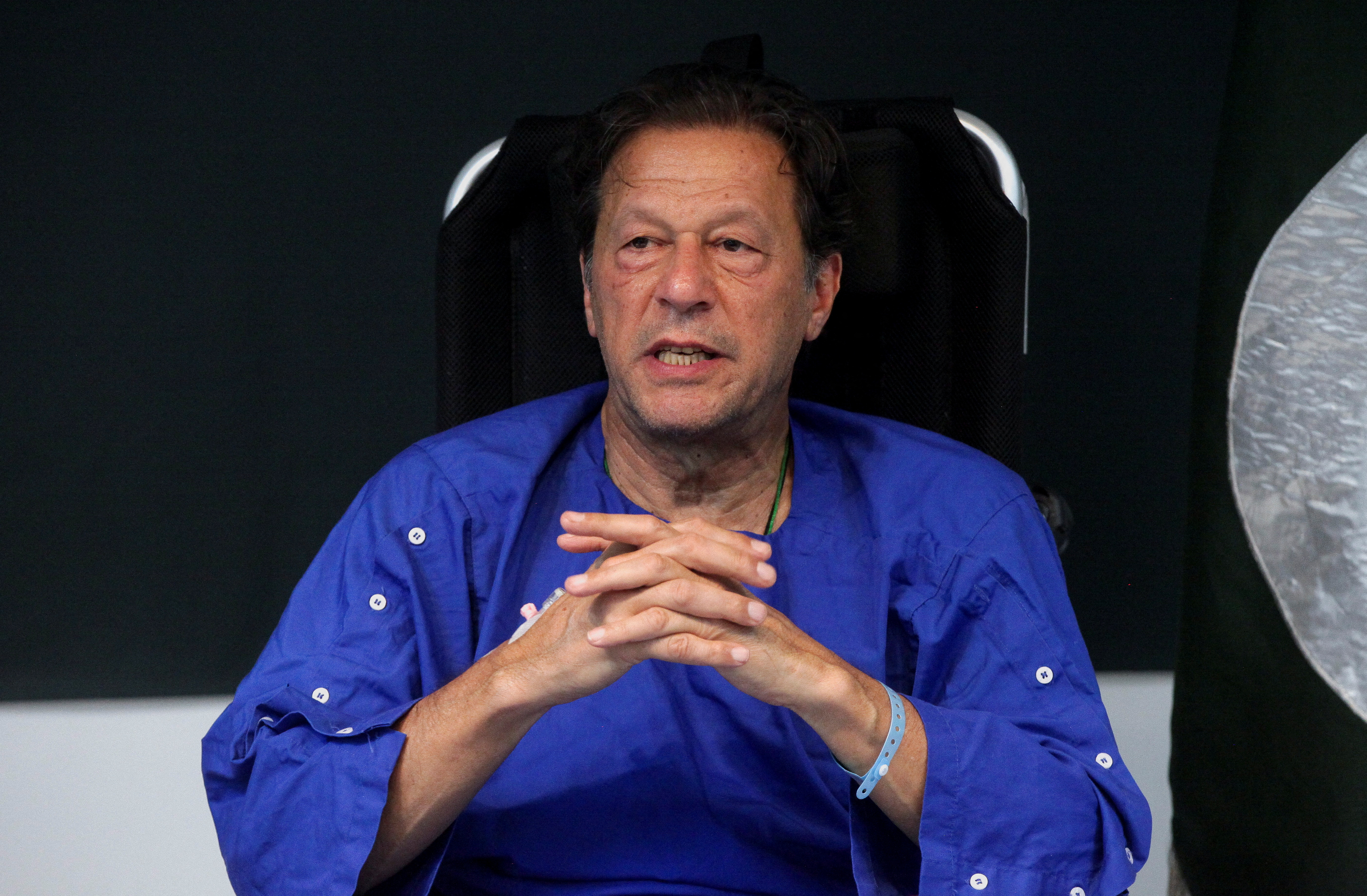 Former Pakistan's Prime Minister Imran Khan addresses a news conference after he was wounded following a shooting incident during a long march in Wazirabad