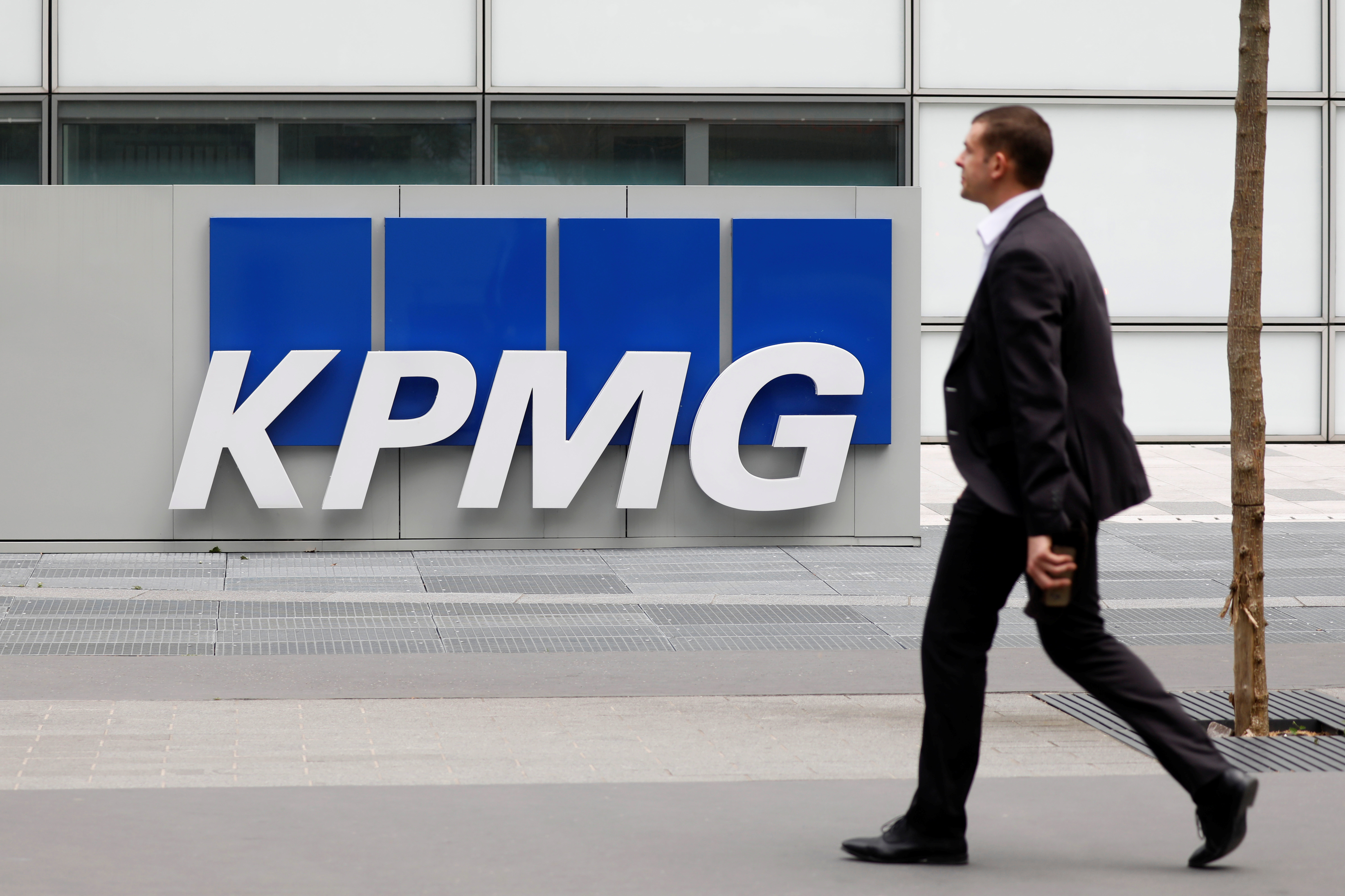 The KPMG logo is seen at the company's head offices at La Defense business and financial district in Courbevoie