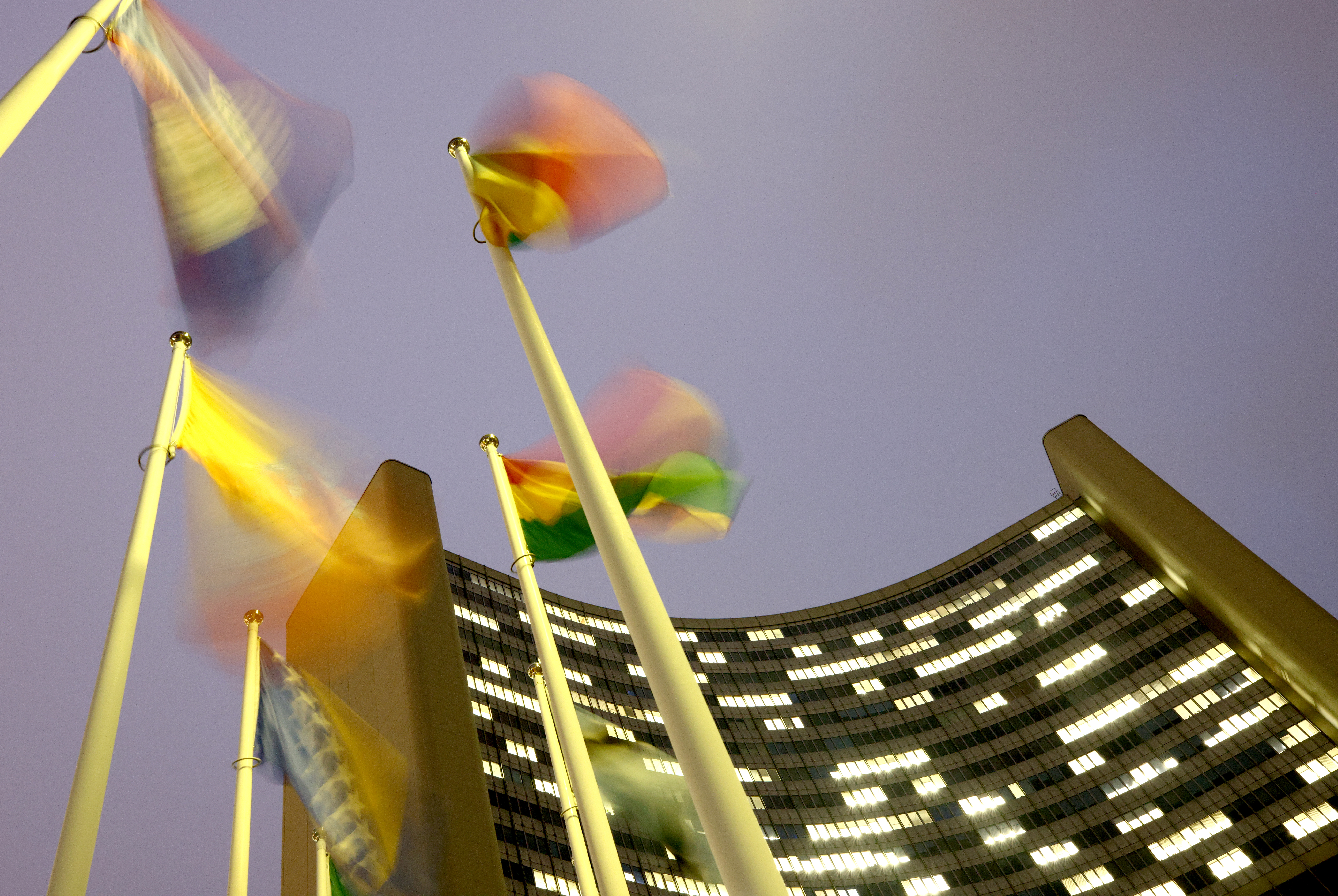 Flags flutter in the wind in front of the headquarters of the International Atomic Energy Agency (IAEA) in Vienna