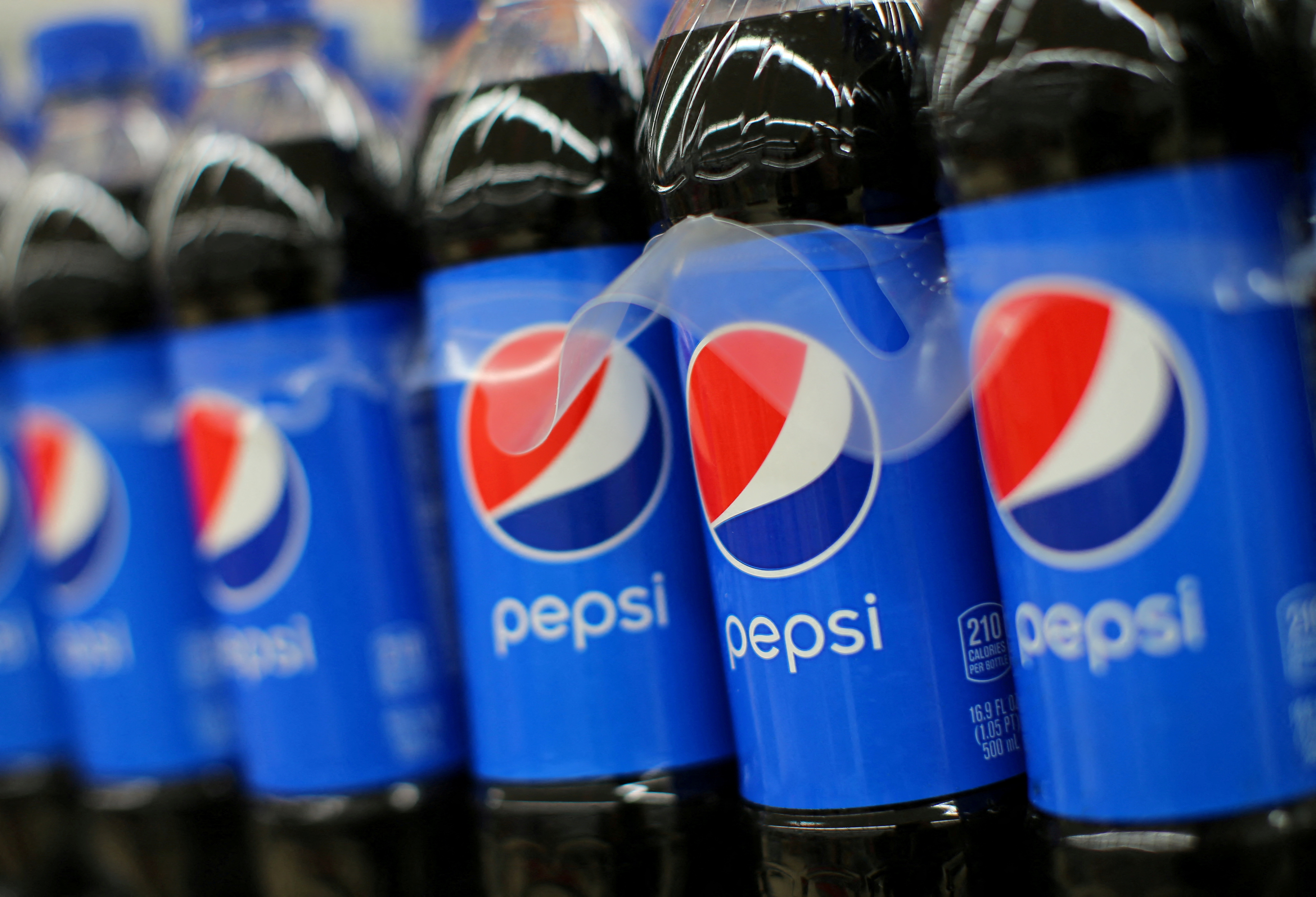 Coca-Cola to push ahead with price hikes as PepsiCo hits pause
