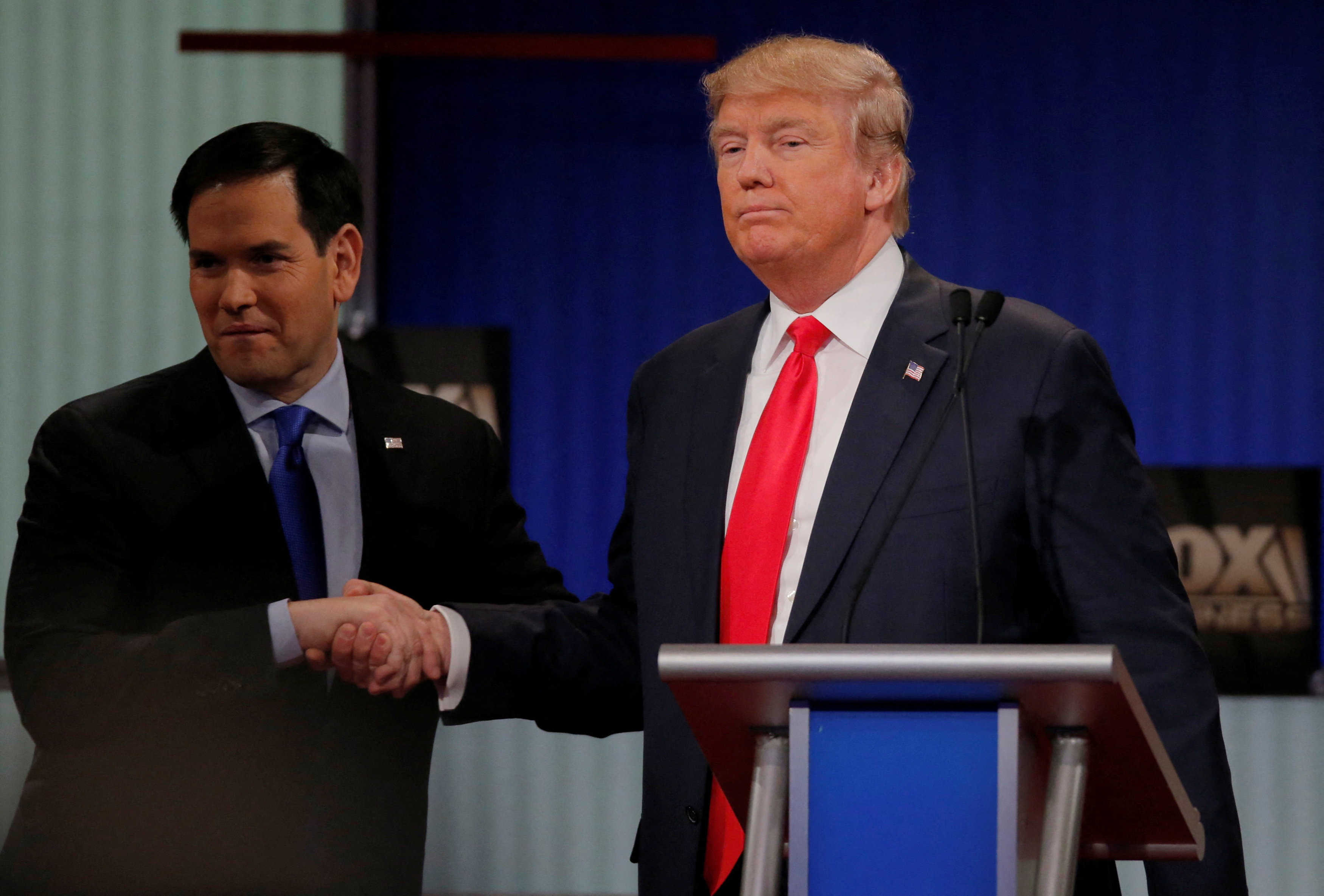 Republican U.S. presidential candidate Rubio shakes hands with rival candidate Trump at the conclusion of the Fox Business Network Republican presidential candidates debate in North Charleston