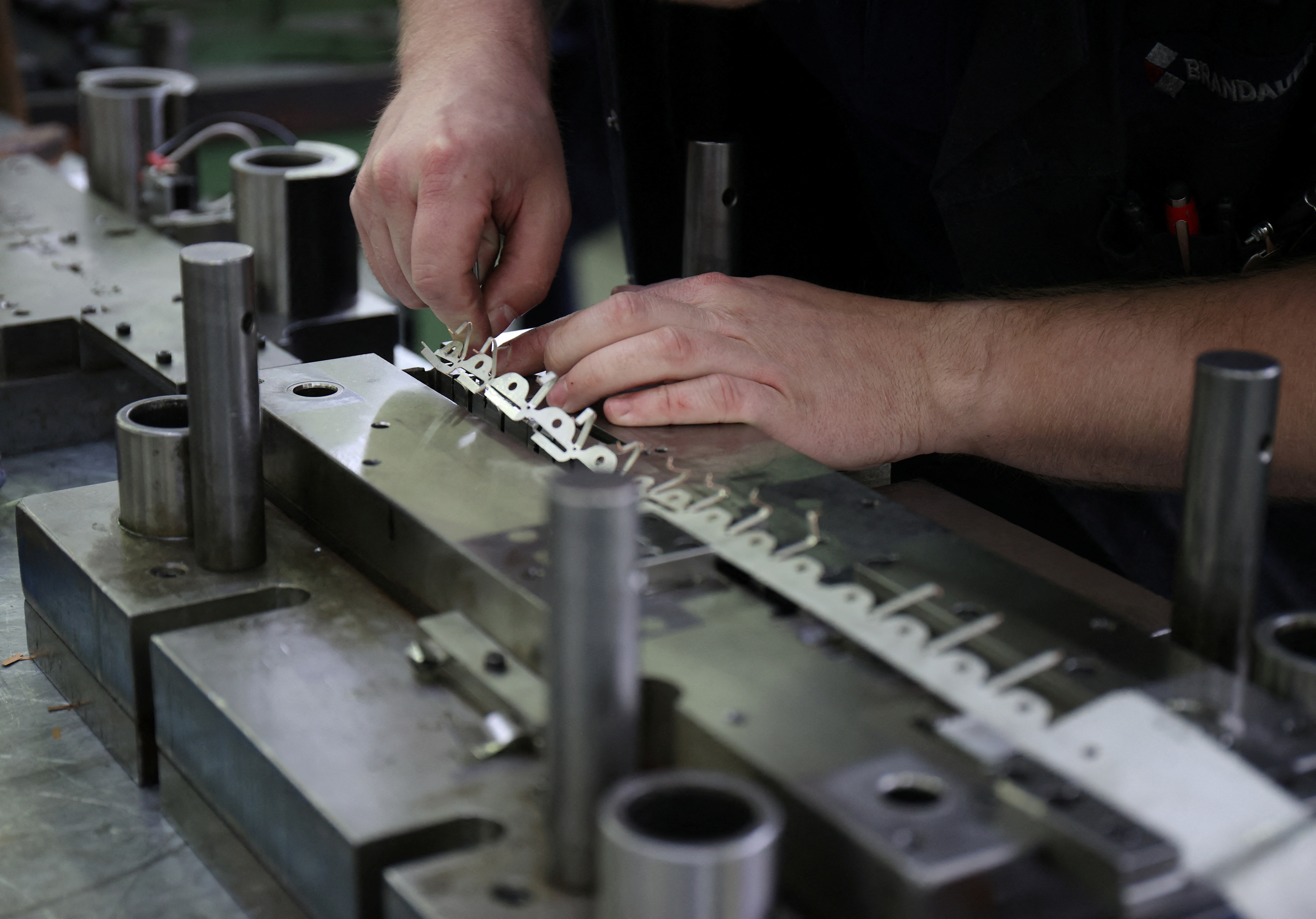 A worker in Brandauer's factory processes new orders as they benefit from the reshoring of manufacturing following global supply chain disruption in Birmingham