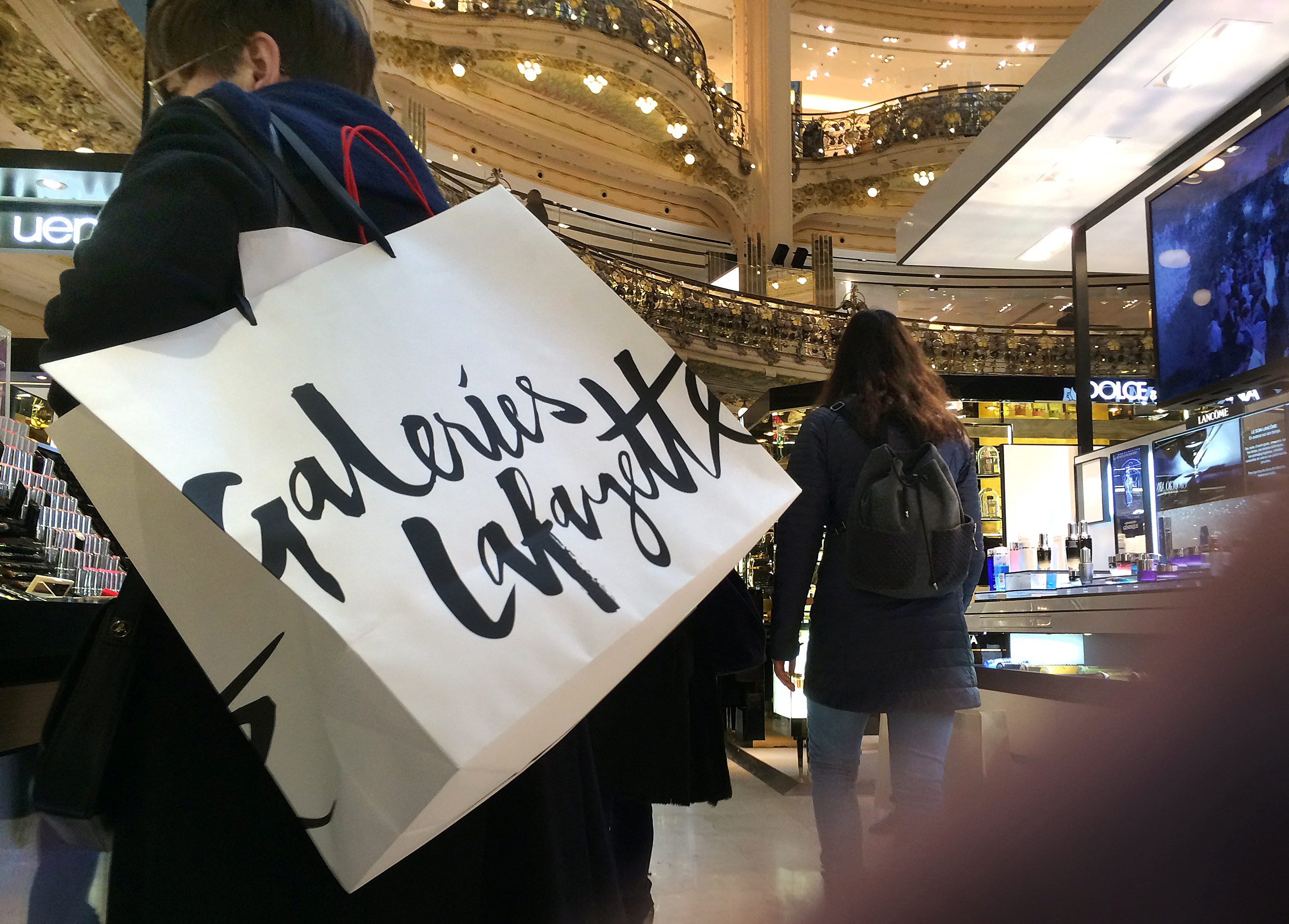 A shopper in the Galeries Lafayette department store in Paris, France