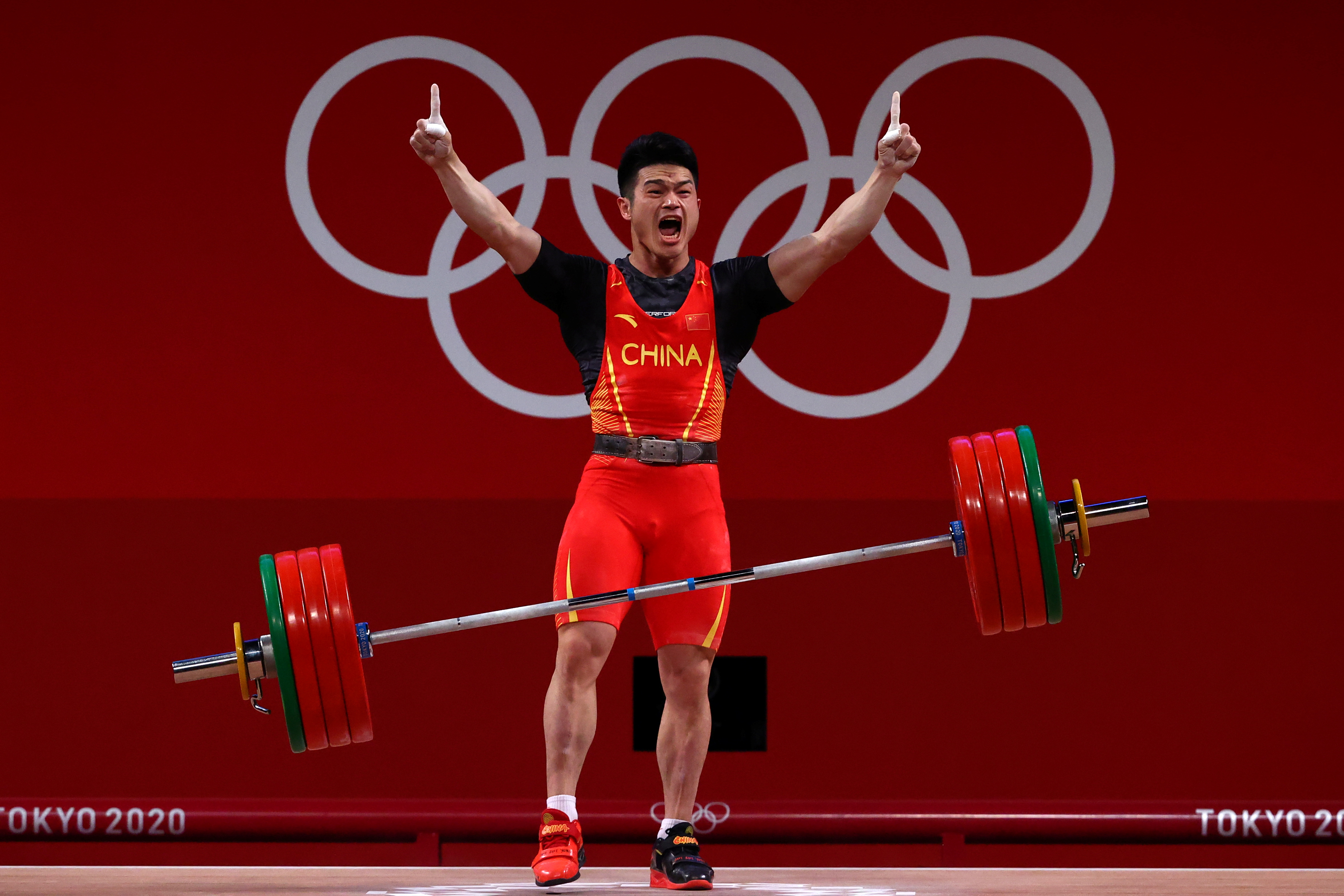 Weightlifting-China's Shi breaks world record to win gold in 73kg category