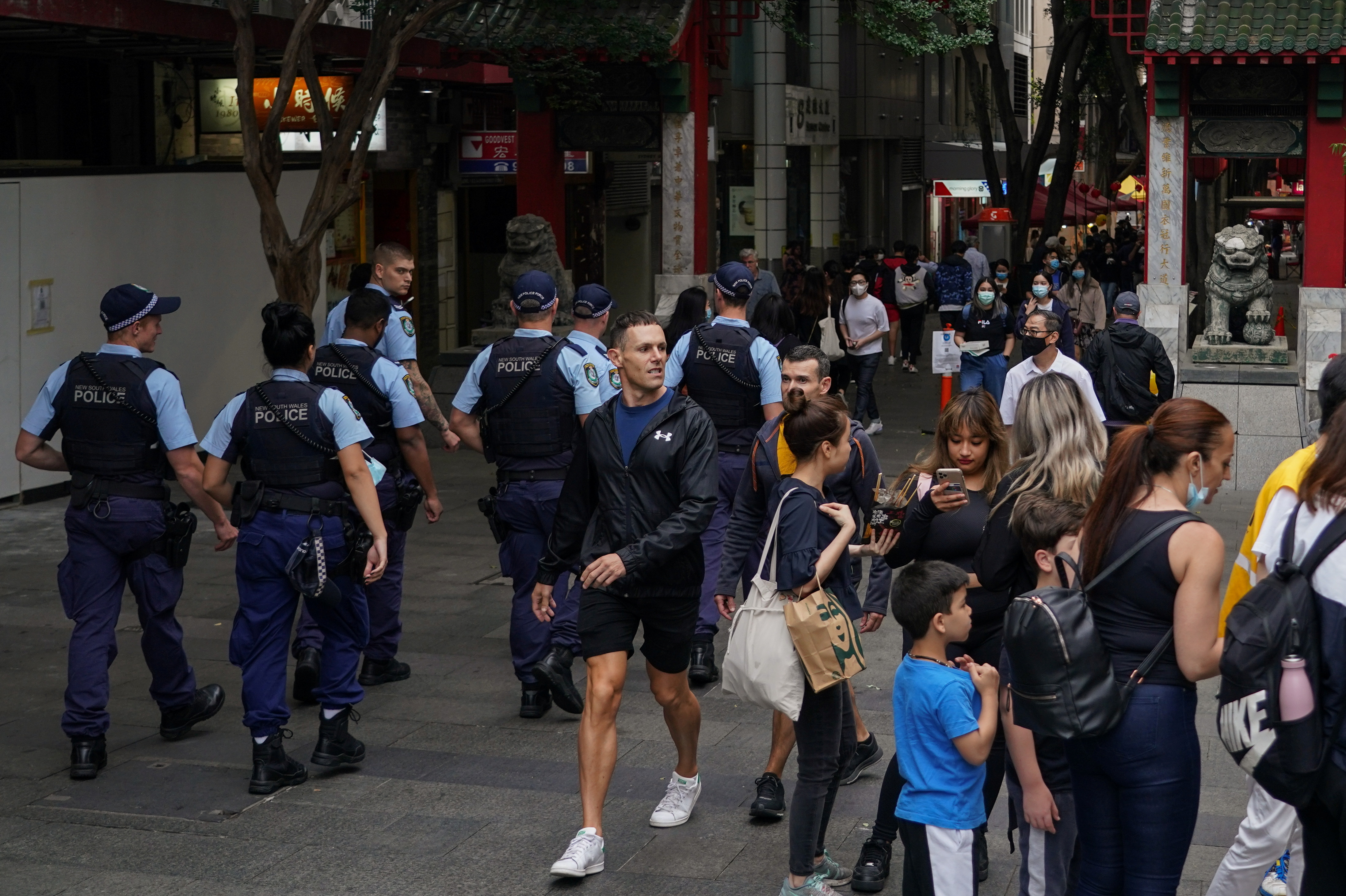 Police officers patrol through the city centre, as coronavirus disease (COVID-19) vaccination rates continue to rise, in Sydney, Australia, November 19, 2021.  REUTERS/Loren Elliott