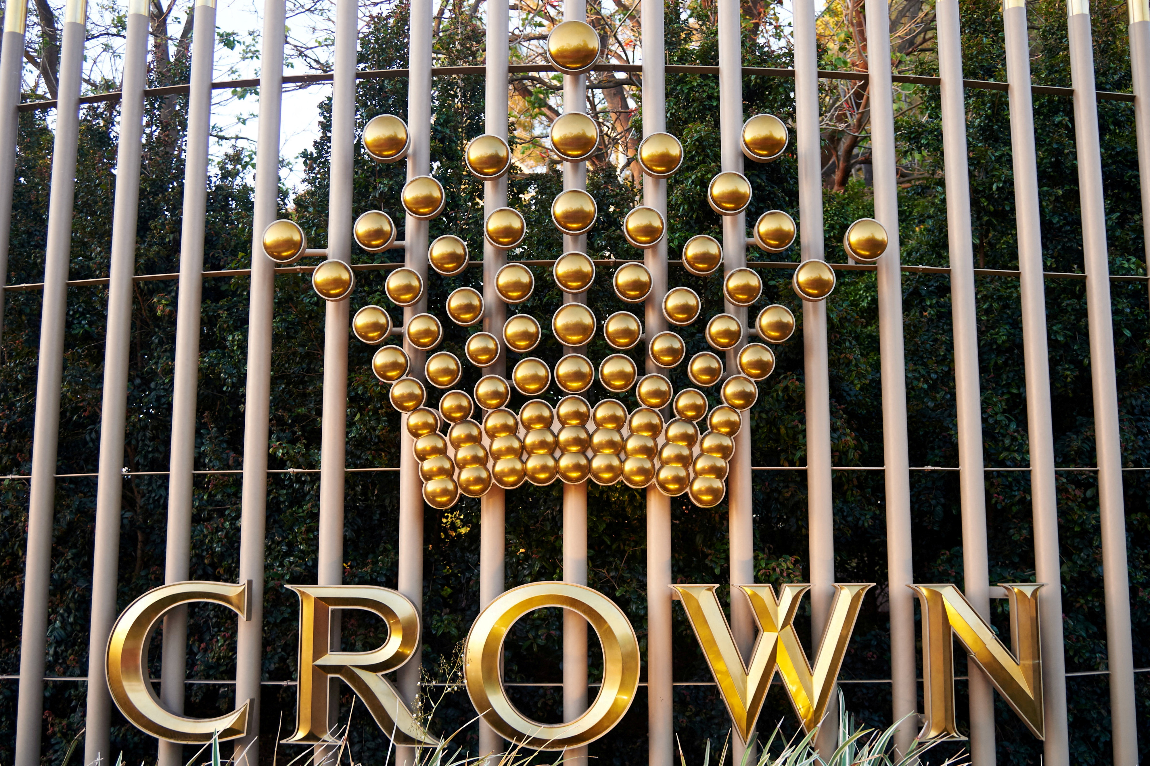 The logo of Australian casino operator Crown Resorts adorns a fence surrounding the Crown Perth hotel and casino complex in Western Australia