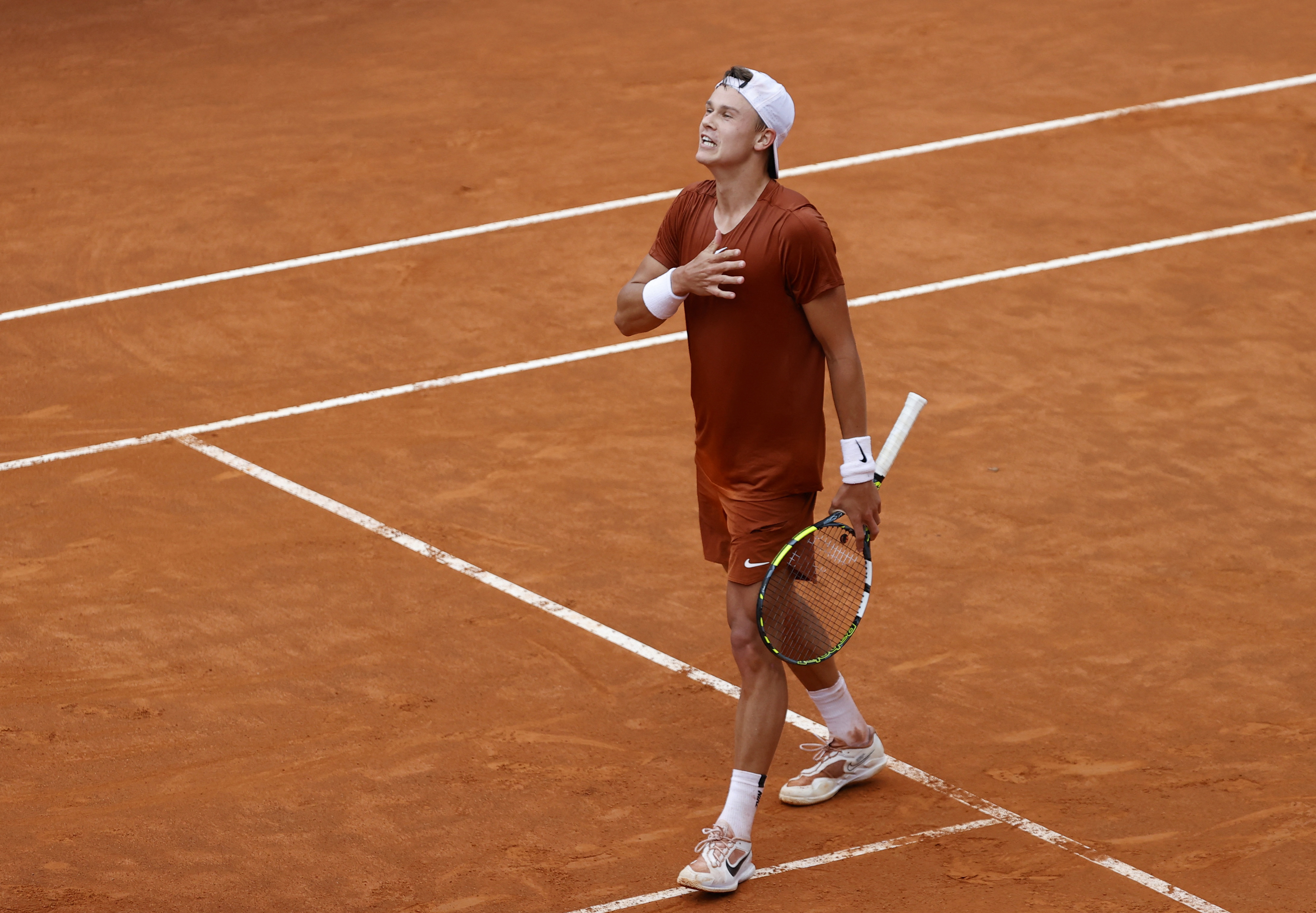 Holger Rune beats Novak Djokovic in rainy Italian Open