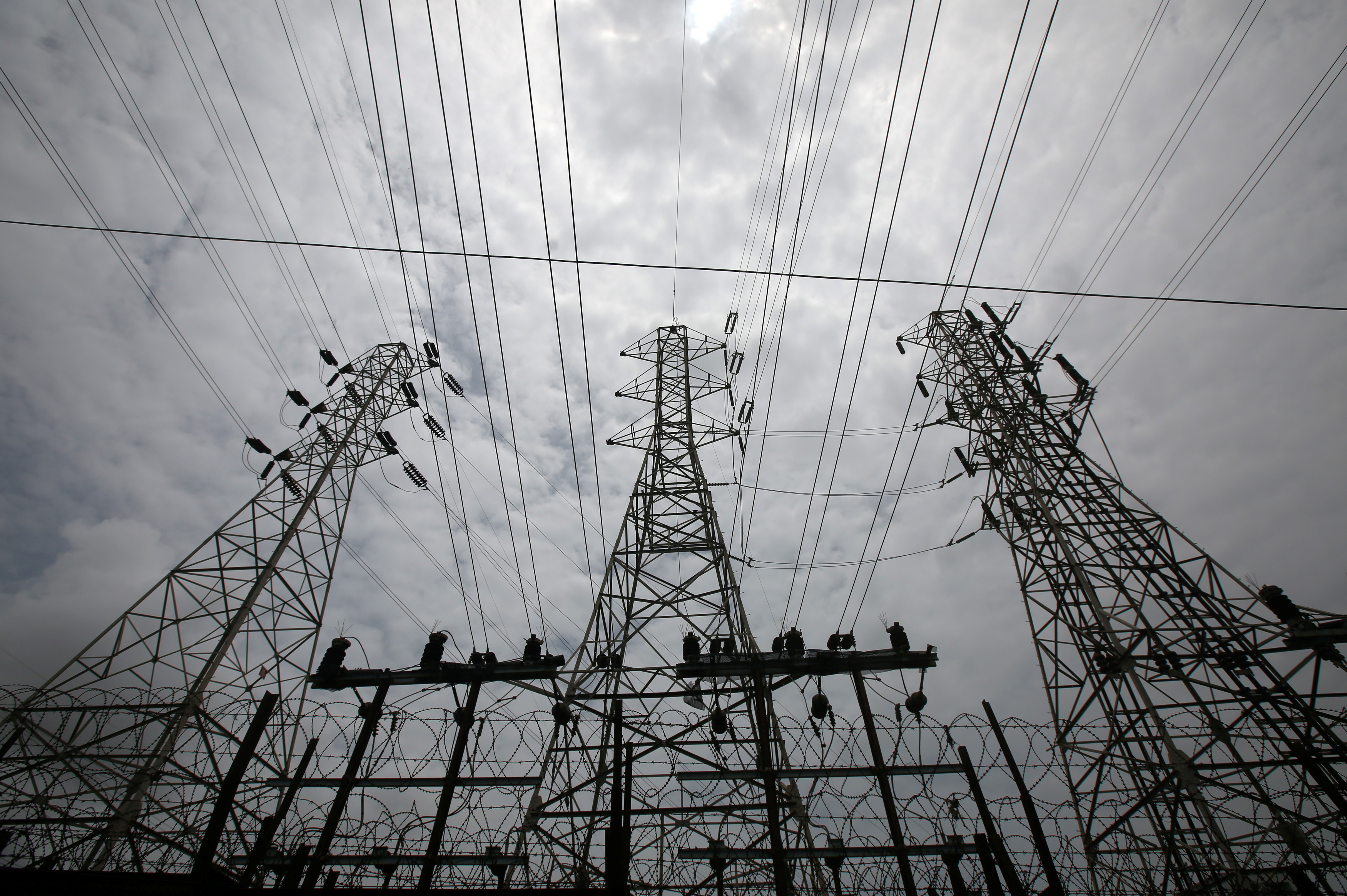 High-tension power lines are pictured outside a Tata Power sub station in the suburbs of Mumbai