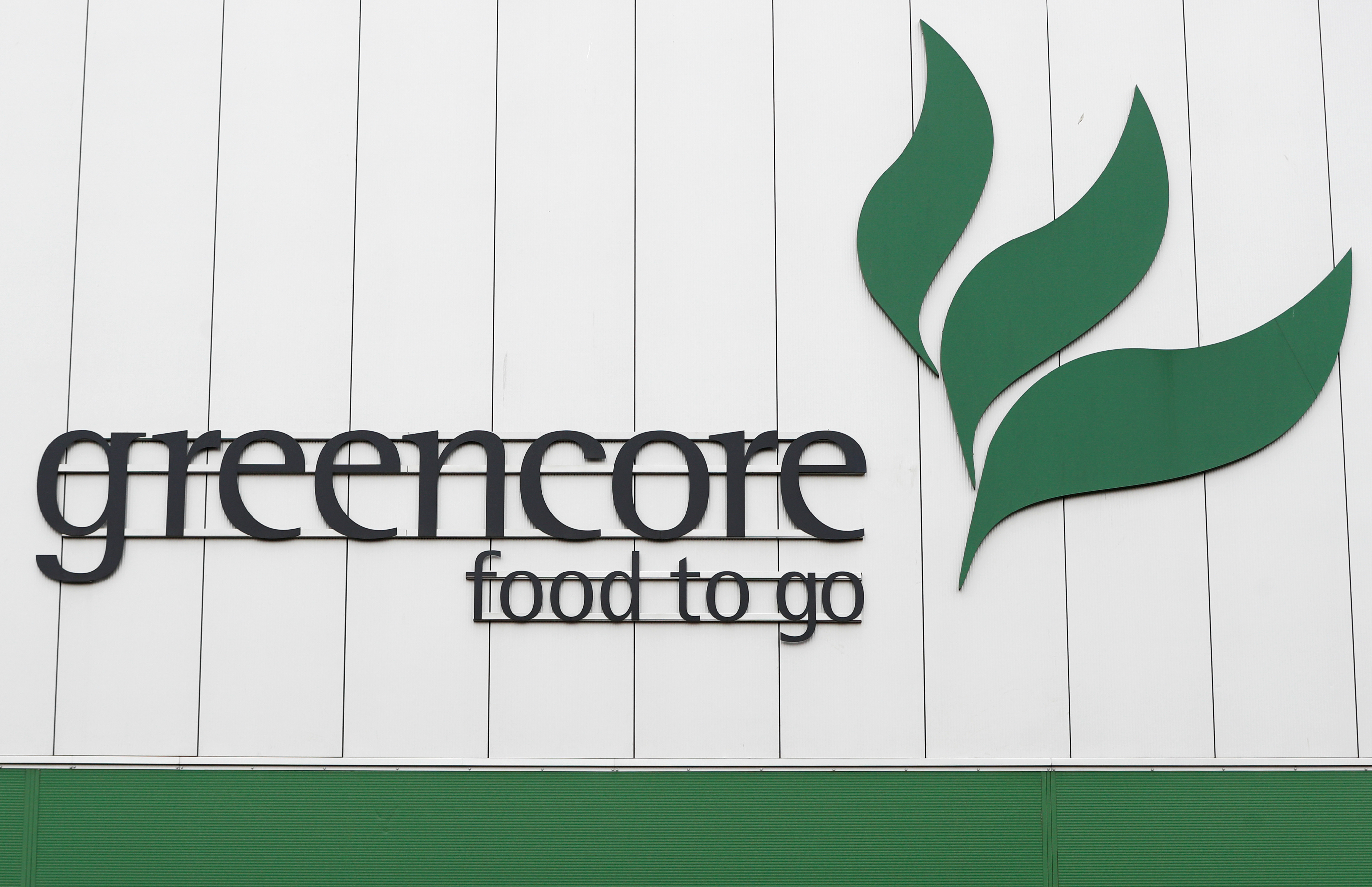 A Greencore sandwich factory's logo is seen on a building, in Northampton